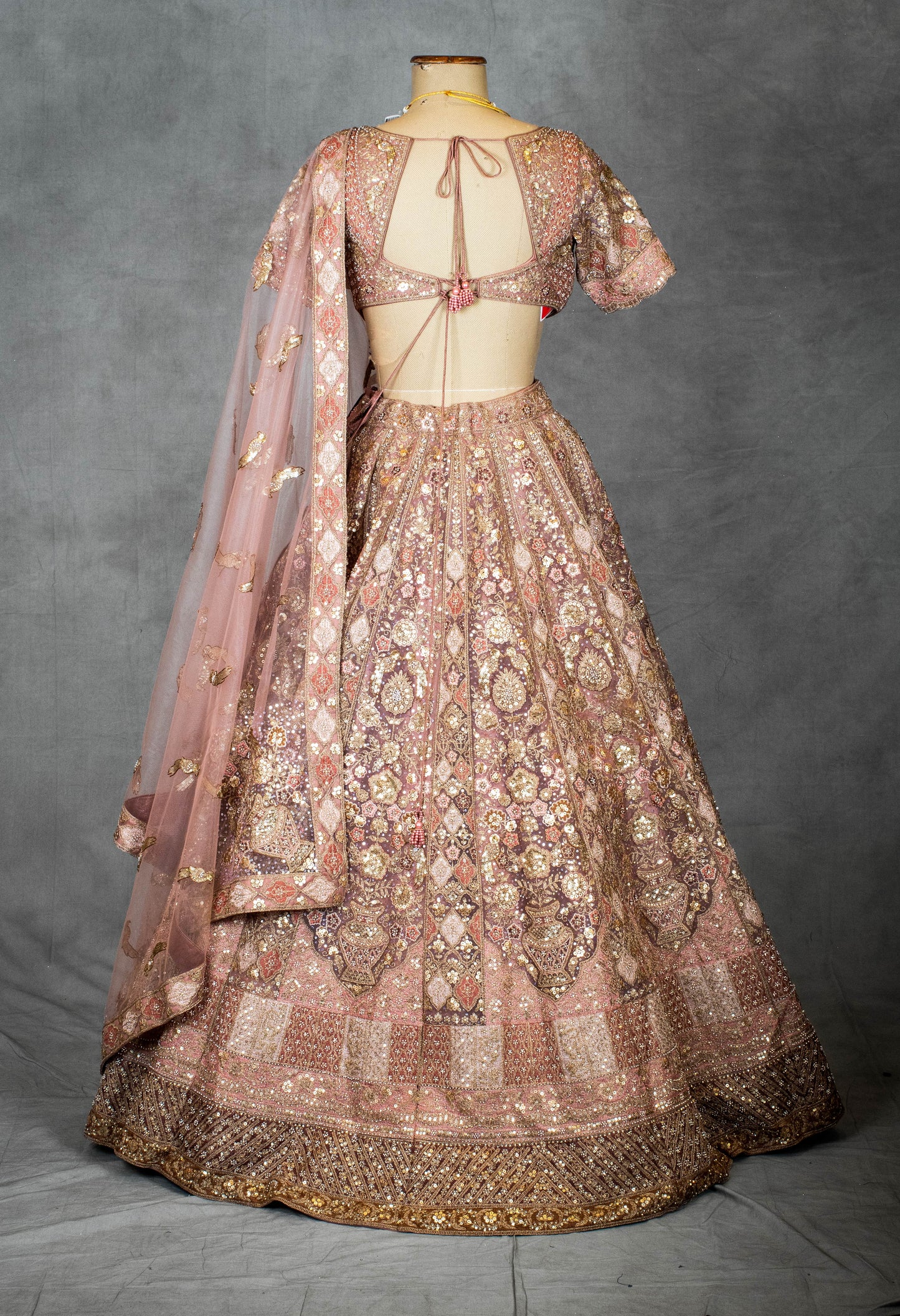 Pastel Dusty Rose Bridal Lehenga with Sequin Embroidery and Net Dupatta