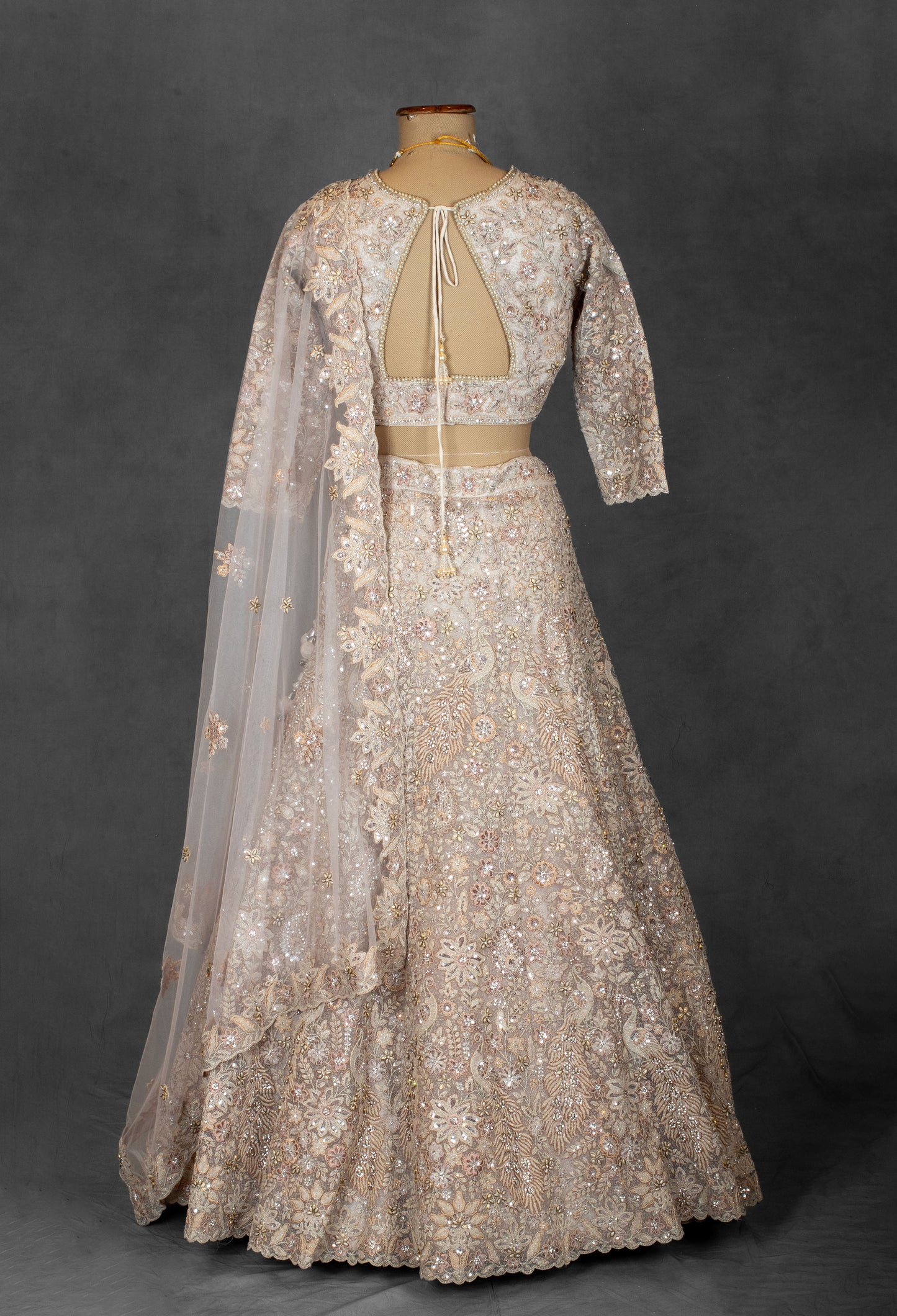Embroidered Designer Bridal Lehenga in Pastel Beige with Sequins & Zari Work