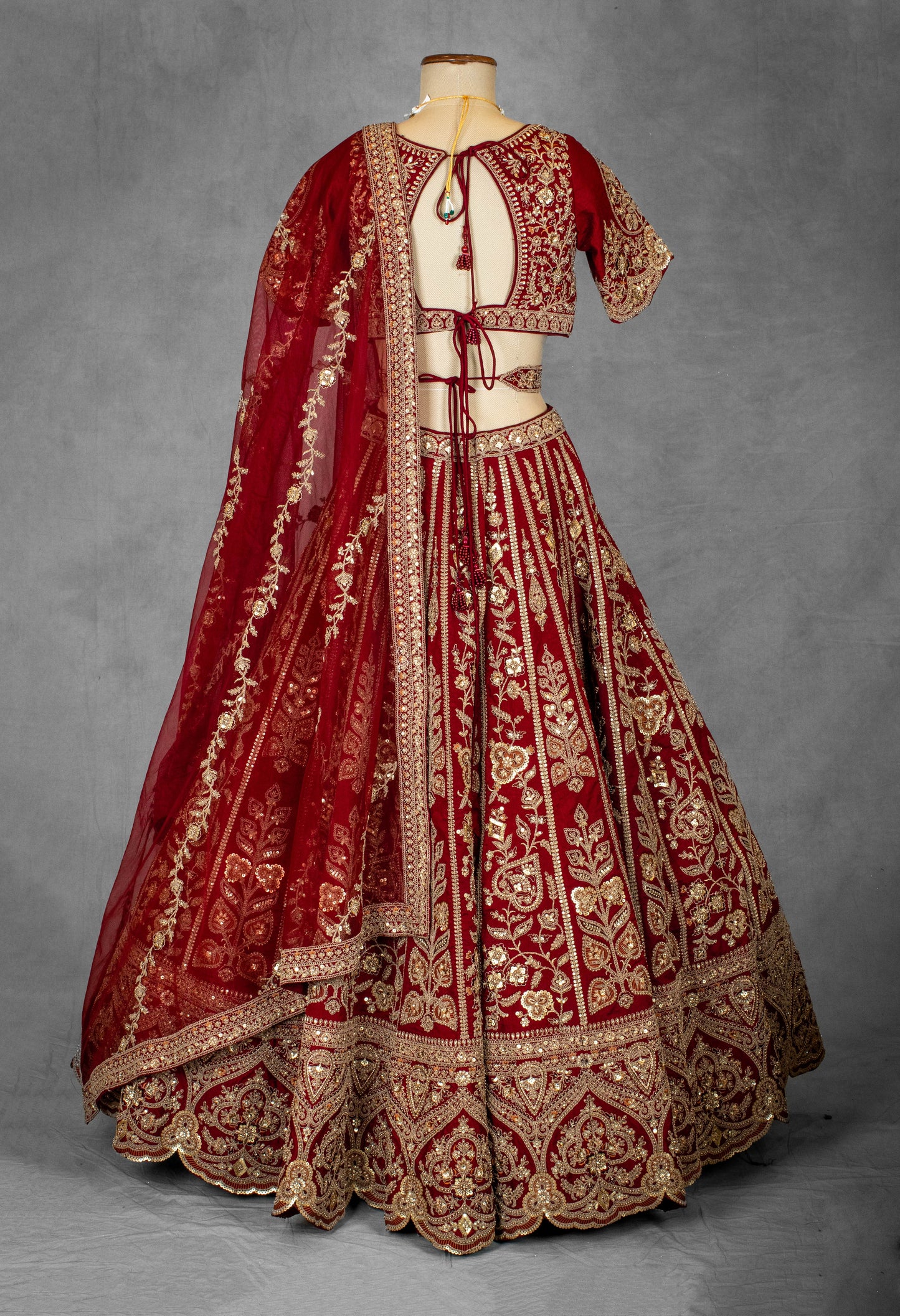 Classic Red Bridal Lehenga with Heavy Golden Embroidery and Net Dupatta