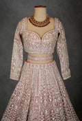 Designer Bridal Lehenga in Blush Pink with Heavy Embroidery and Net Dupatta
