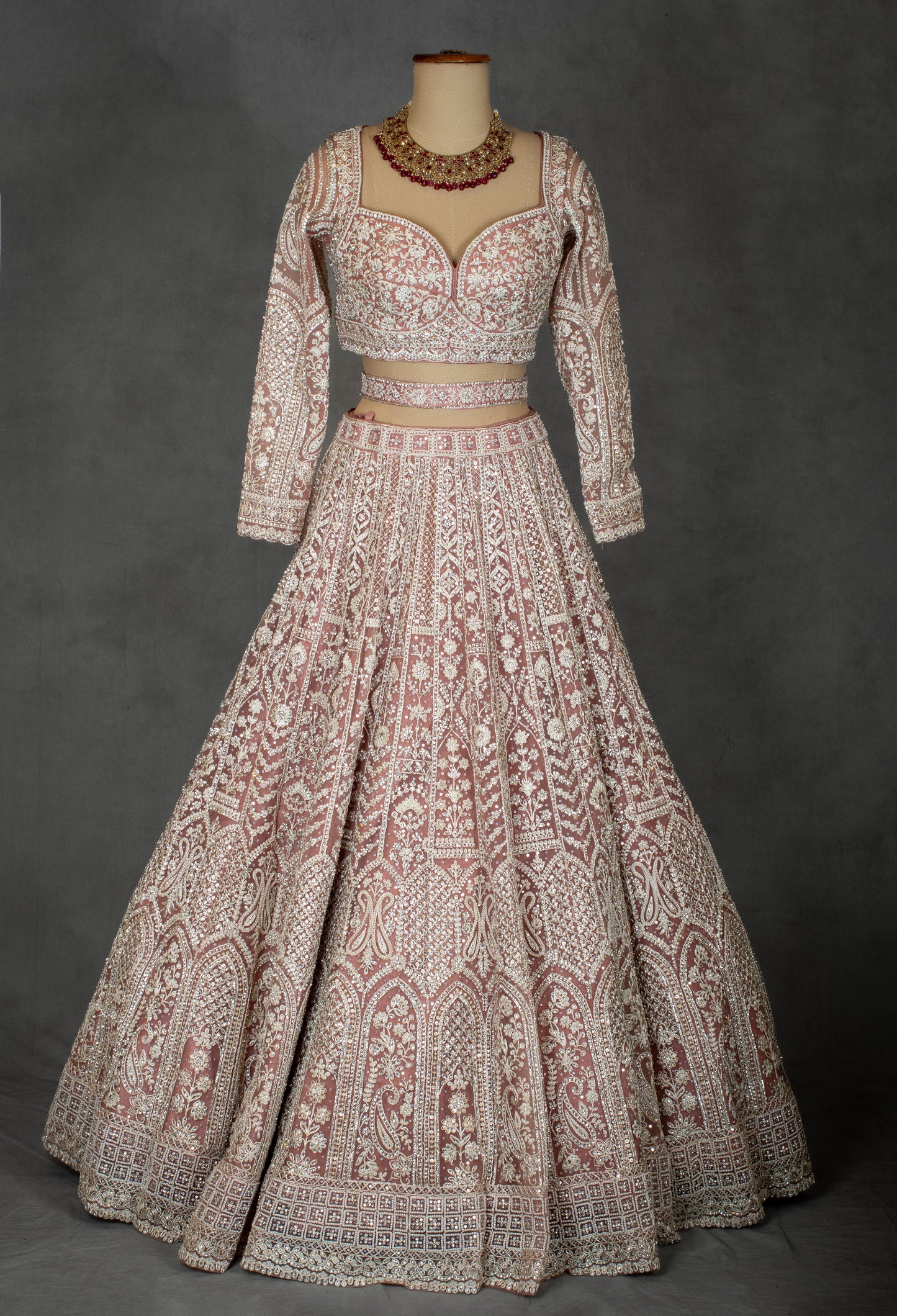 Designer Bridal Lehenga in Blush Pink with Heavy Embroidery and Net Dupatta