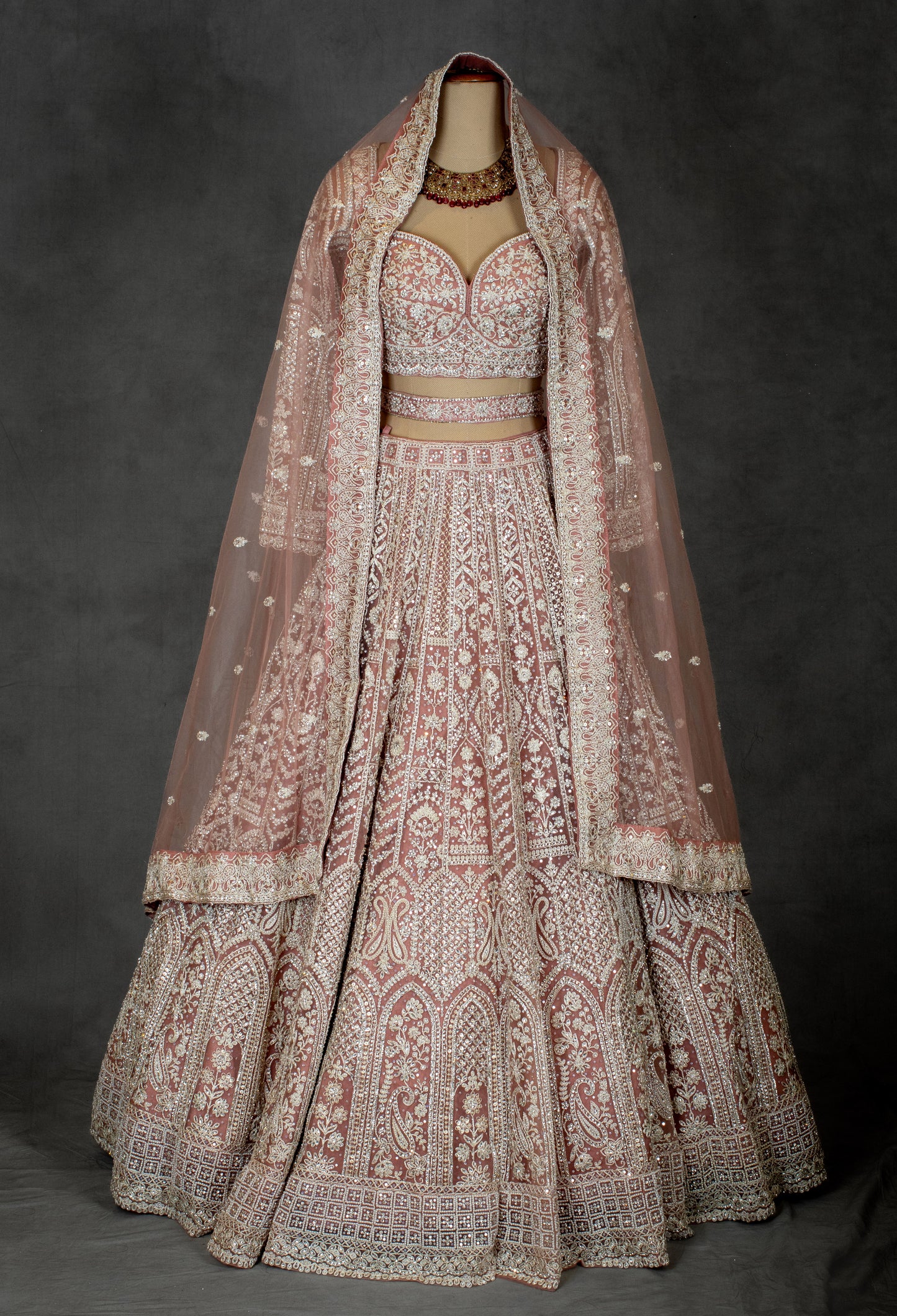 Designer Bridal Lehenga in Blush Pink with Heavy Embroidery and Net Dupatta