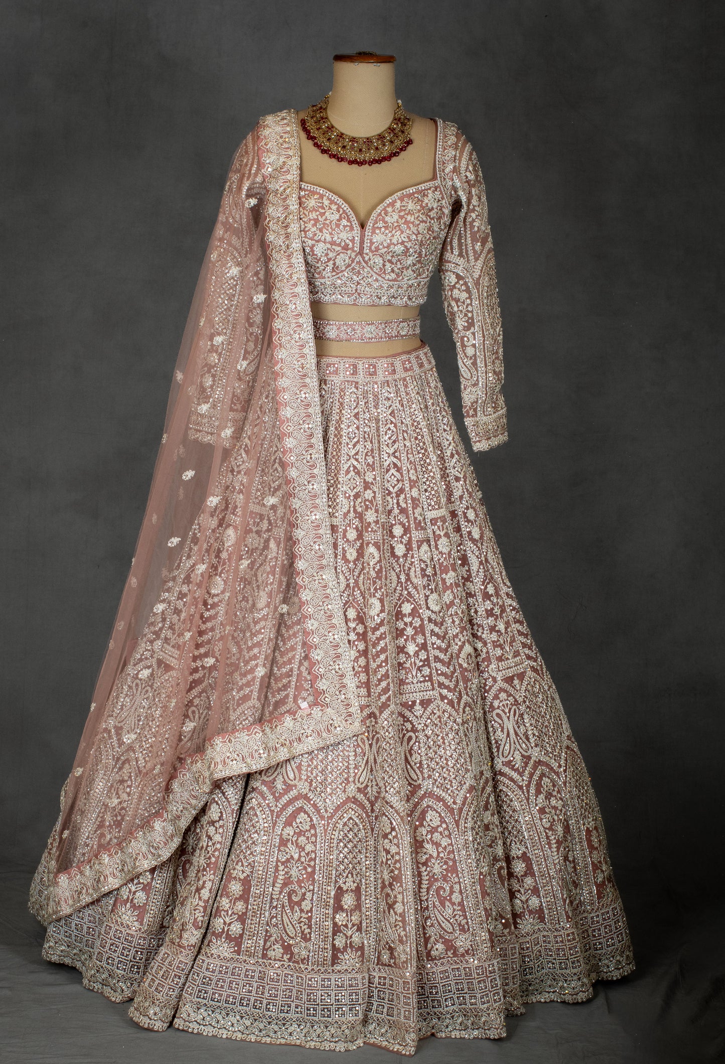 Designer Bridal Lehenga in Blush Pink with Heavy Embroidery and Net Dupatta
