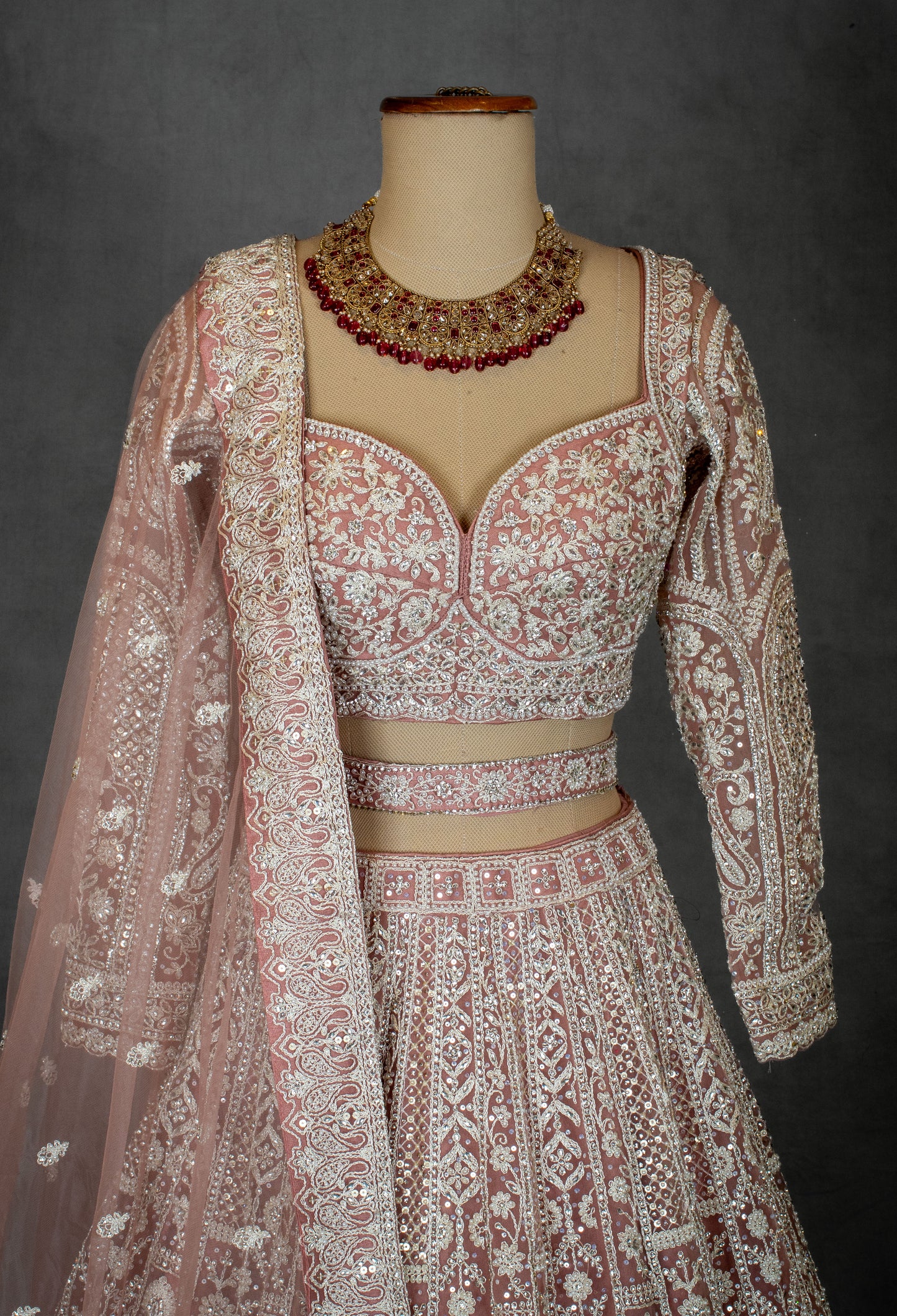 Designer Bridal Lehenga in Blush Pink with Heavy Embroidery and Net Dupatta