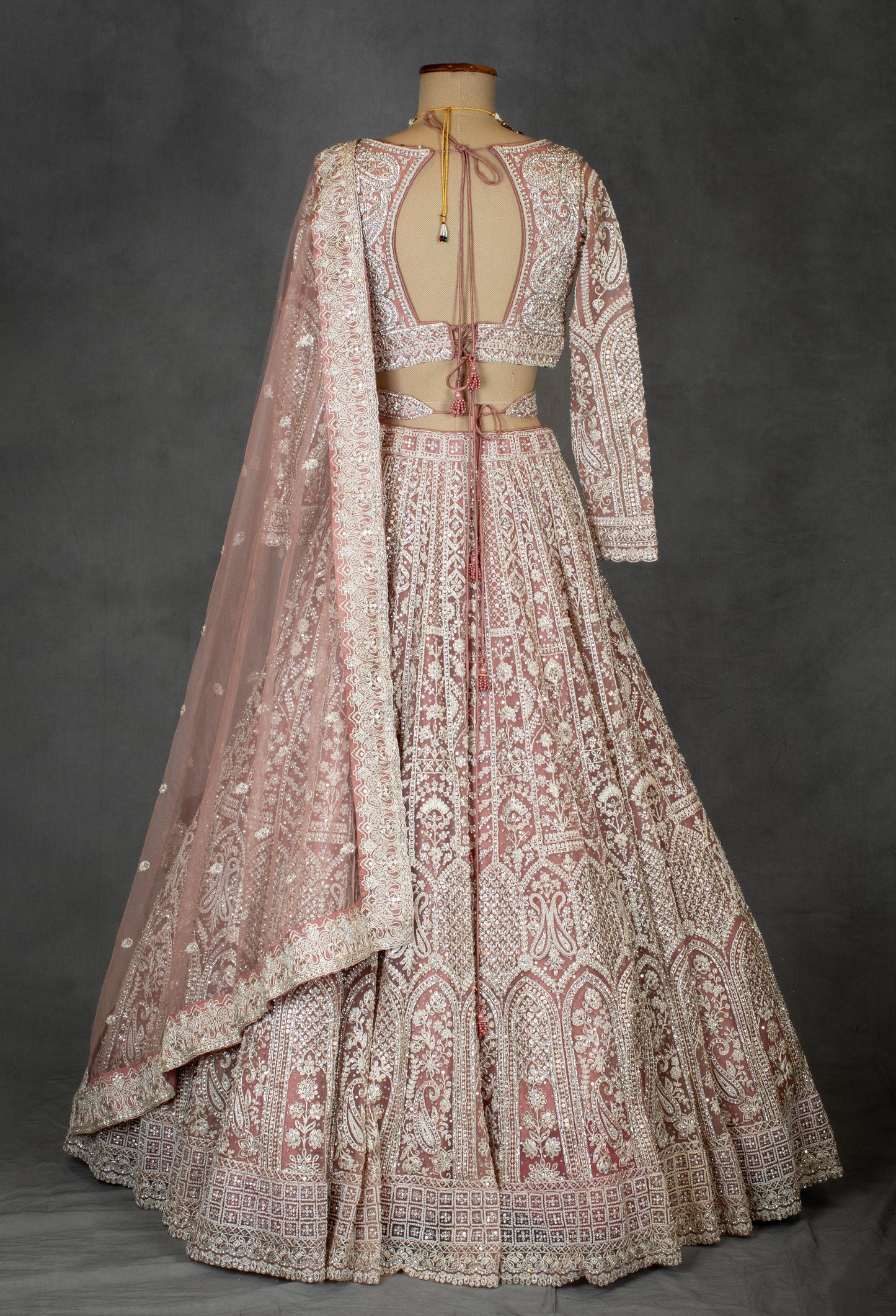 Designer Bridal Lehenga in Blush Pink with Heavy Embroidery and Net Dupatta