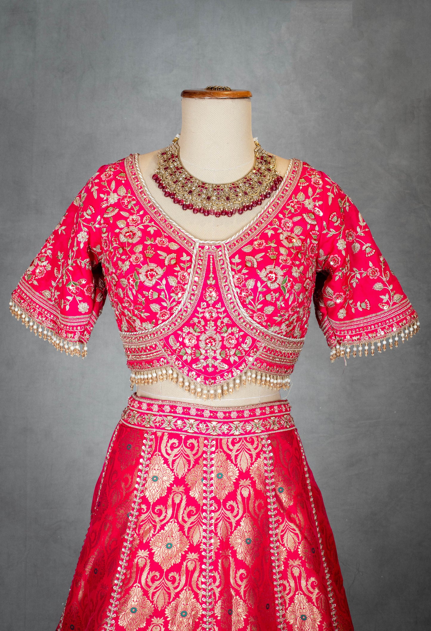 Vibrant Pink Bridal Lehenga with Golden Zari Embroidery and Designer Blouse