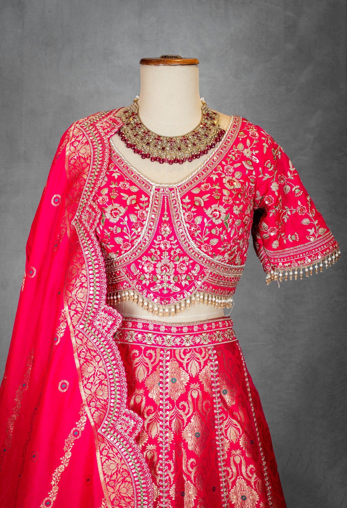 Vibrant Pink Bridal Lehenga with Golden Zari Embroidery and Designer Blouse