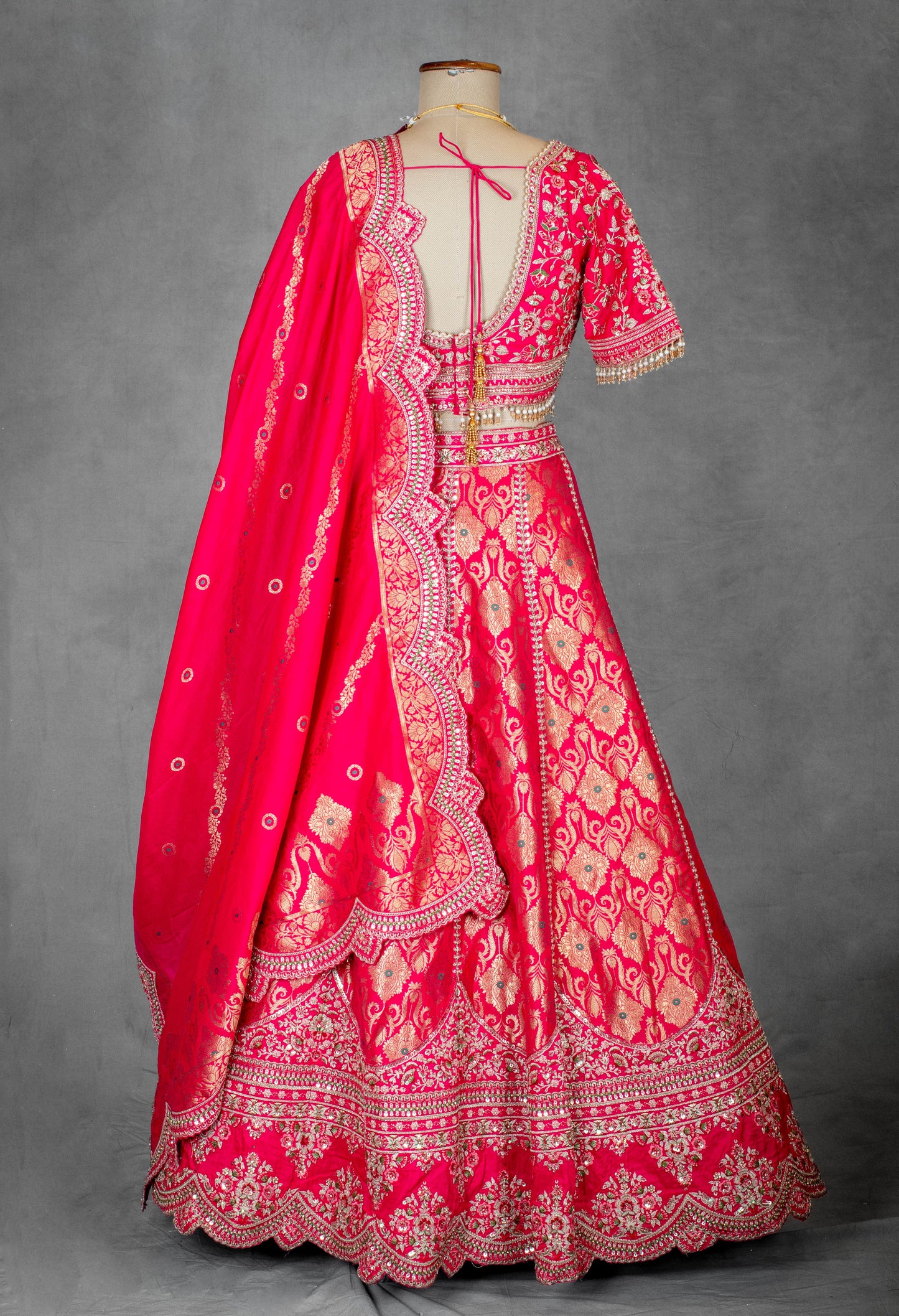 Vibrant Pink Bridal Lehenga with Golden Zari Embroidery and Designer Blouse