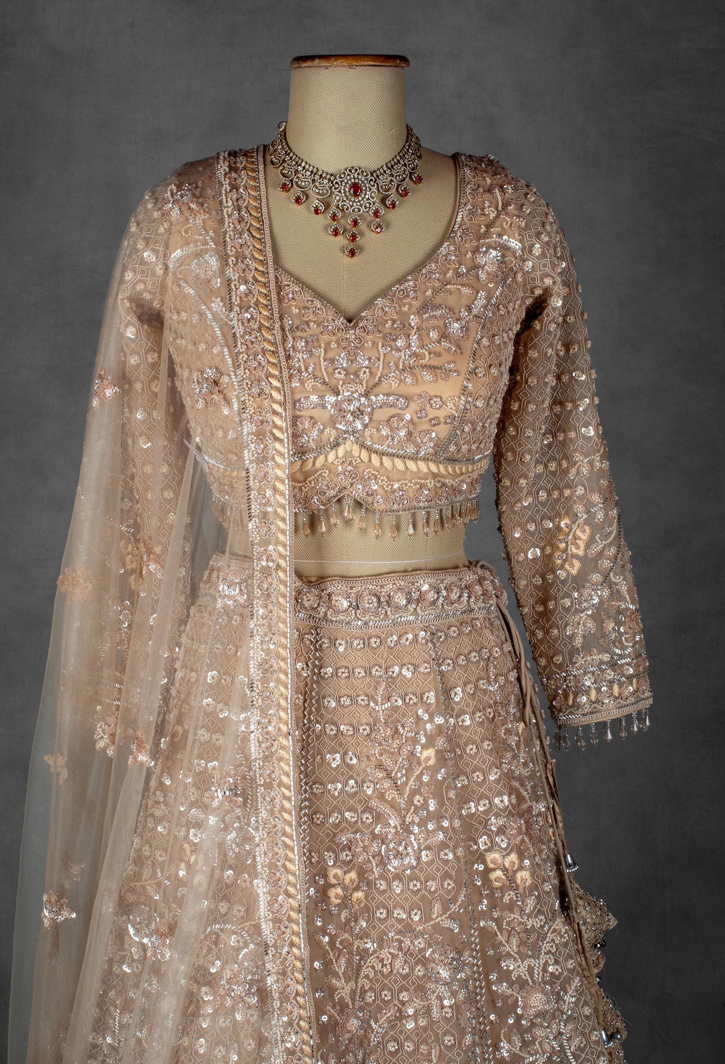 Champagne Gold Hand-Embroidered Sequin Lehenga with Sheer Dupatta & Full Sleeves Blouse
