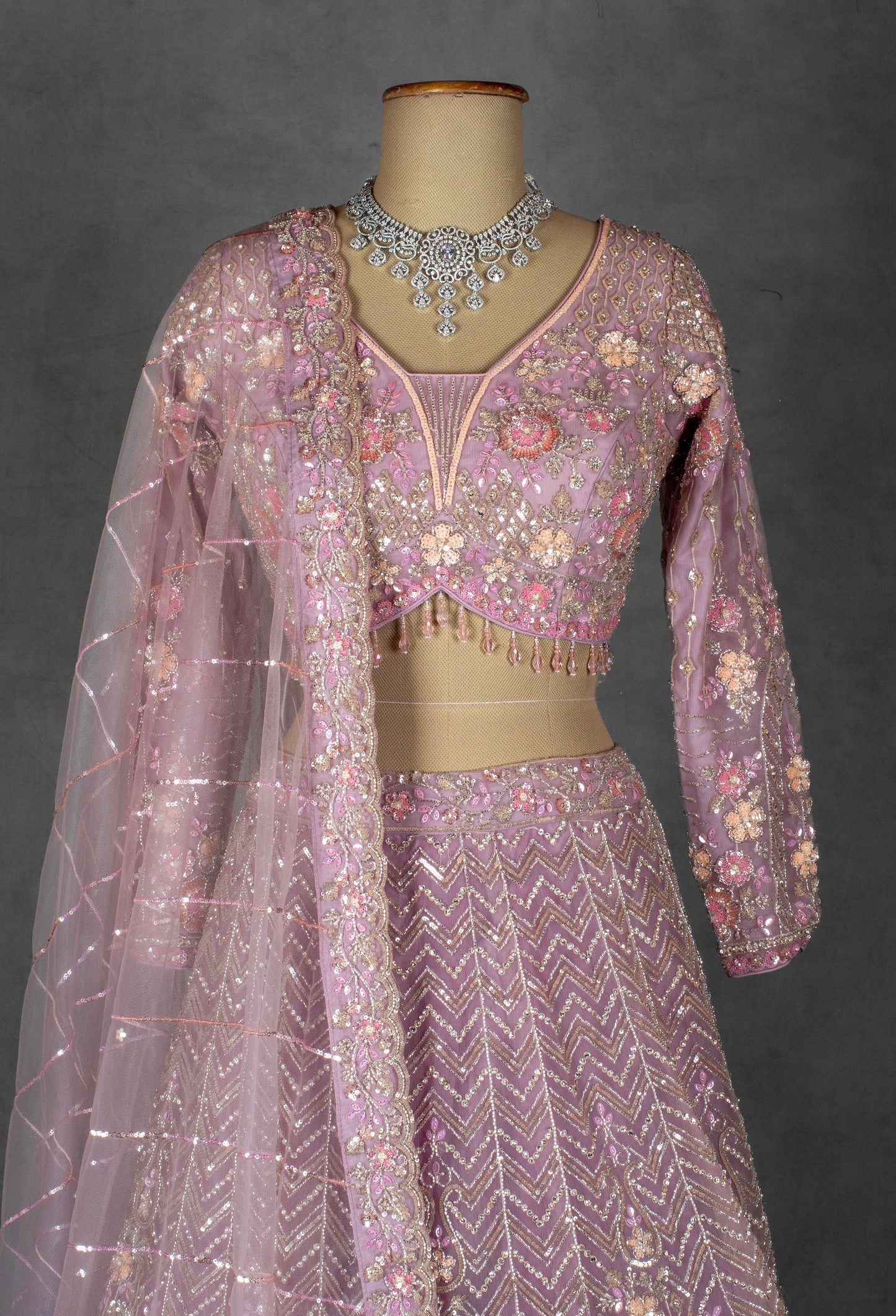 Dusty Mauve Embroidered Crop Top Lehenga with Floral Detailing & Net Dupatta –