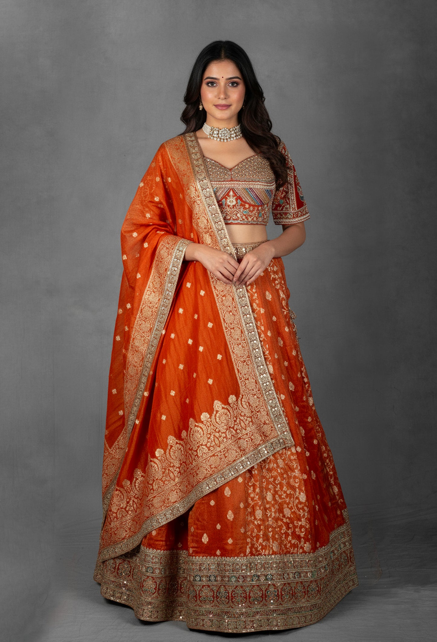 Embellished Orange Bridal Lehenga with Mirror and Zardozi Work
