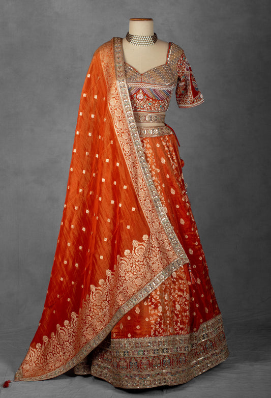 Embellished Orange Bridal Lehenga with Mirror and Zardozi Work