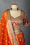 Embellished Orange Bridal Lehenga with Mirror and Zardozi Work