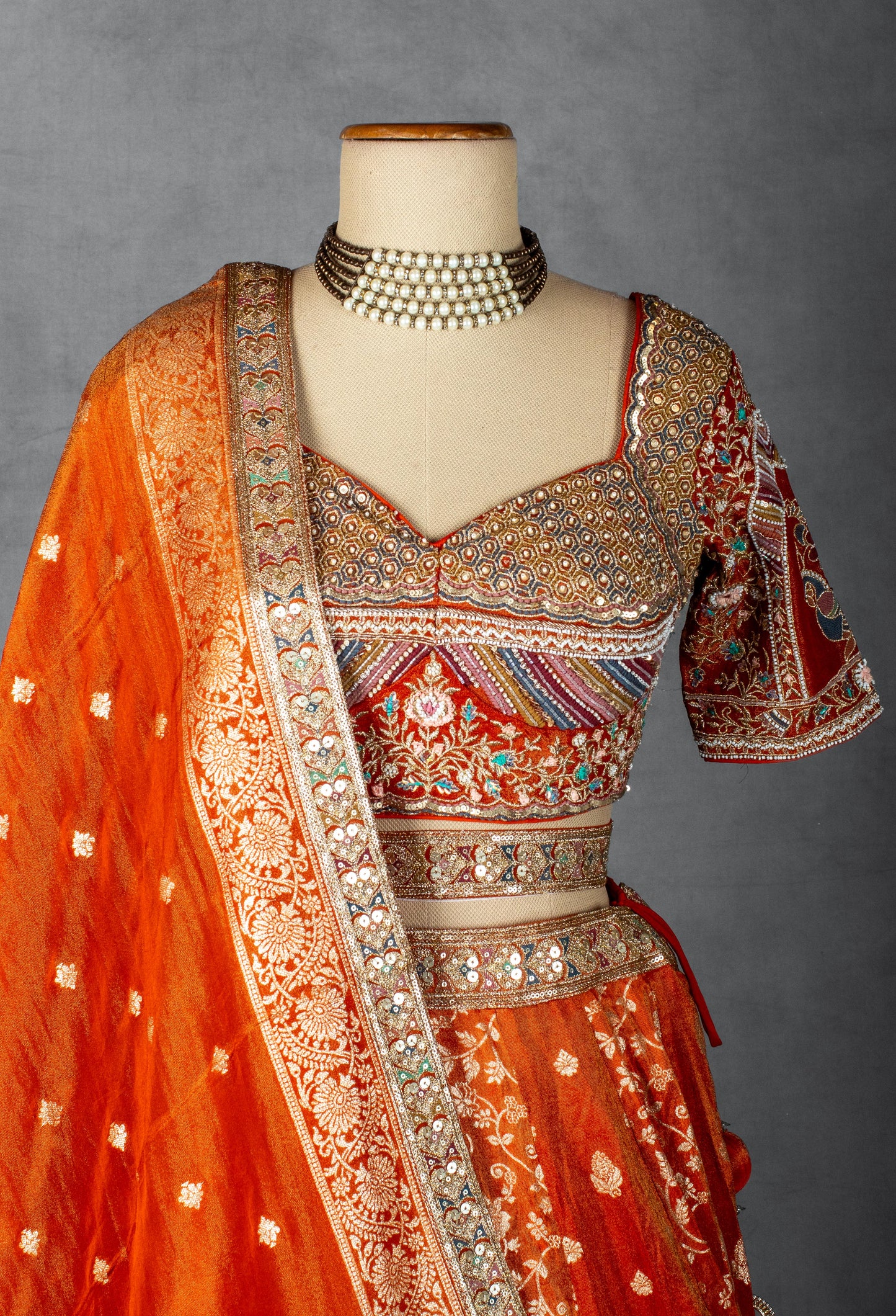 Embellished Orange Bridal Lehenga with Mirror and Zardozi Work