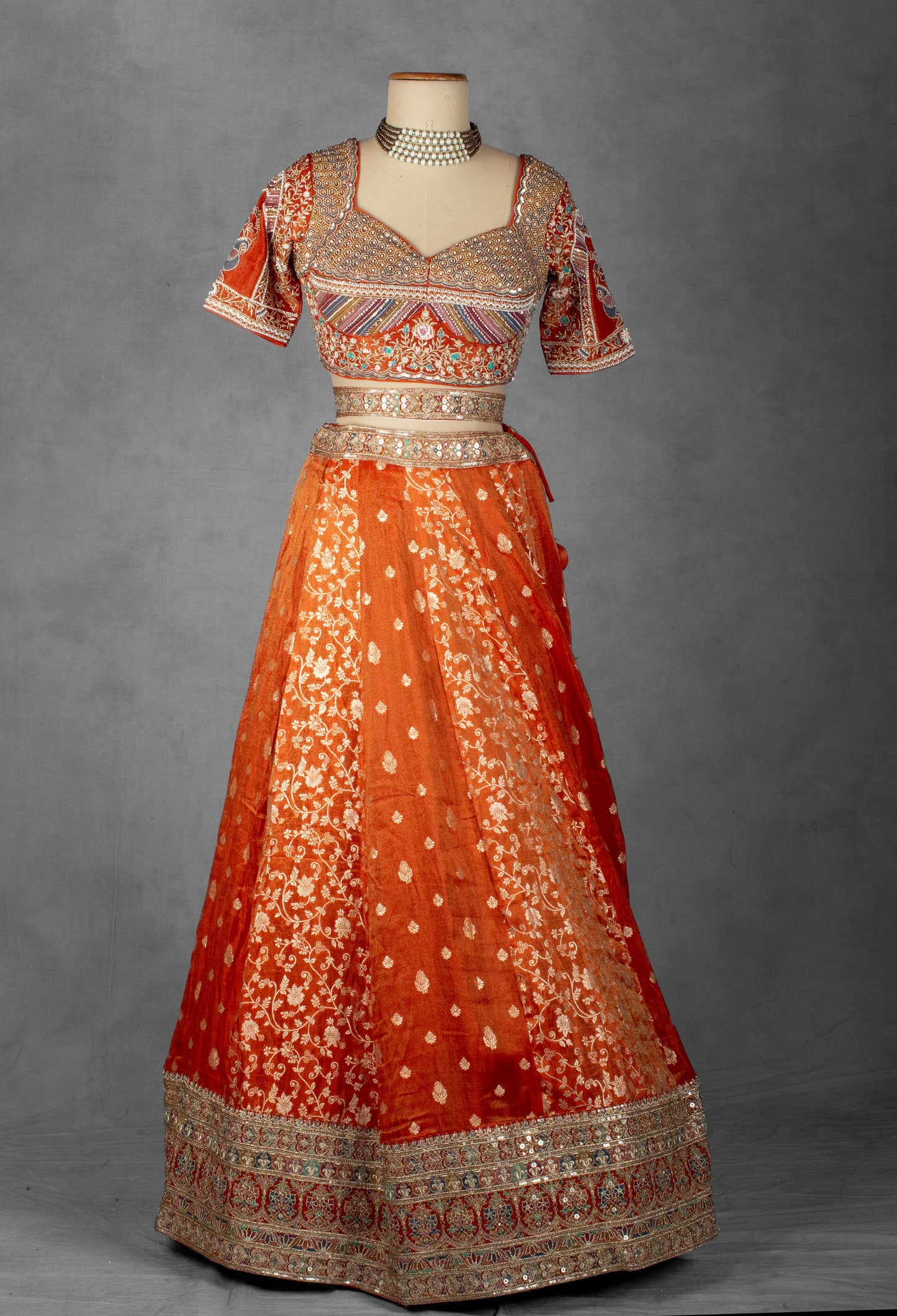 Embellished Orange Bridal Lehenga with Mirror and Zardozi Work