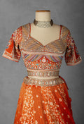 Embellished Orange Bridal Lehenga with Mirror and Zardozi Work