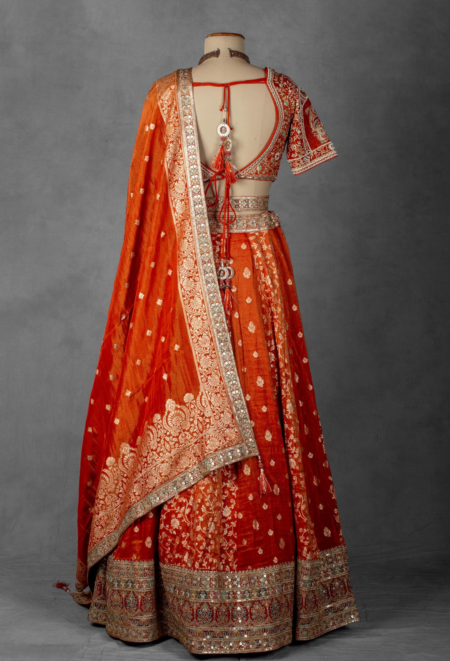 Embellished Orange Bridal Lehenga with Mirror and Zardozi Work