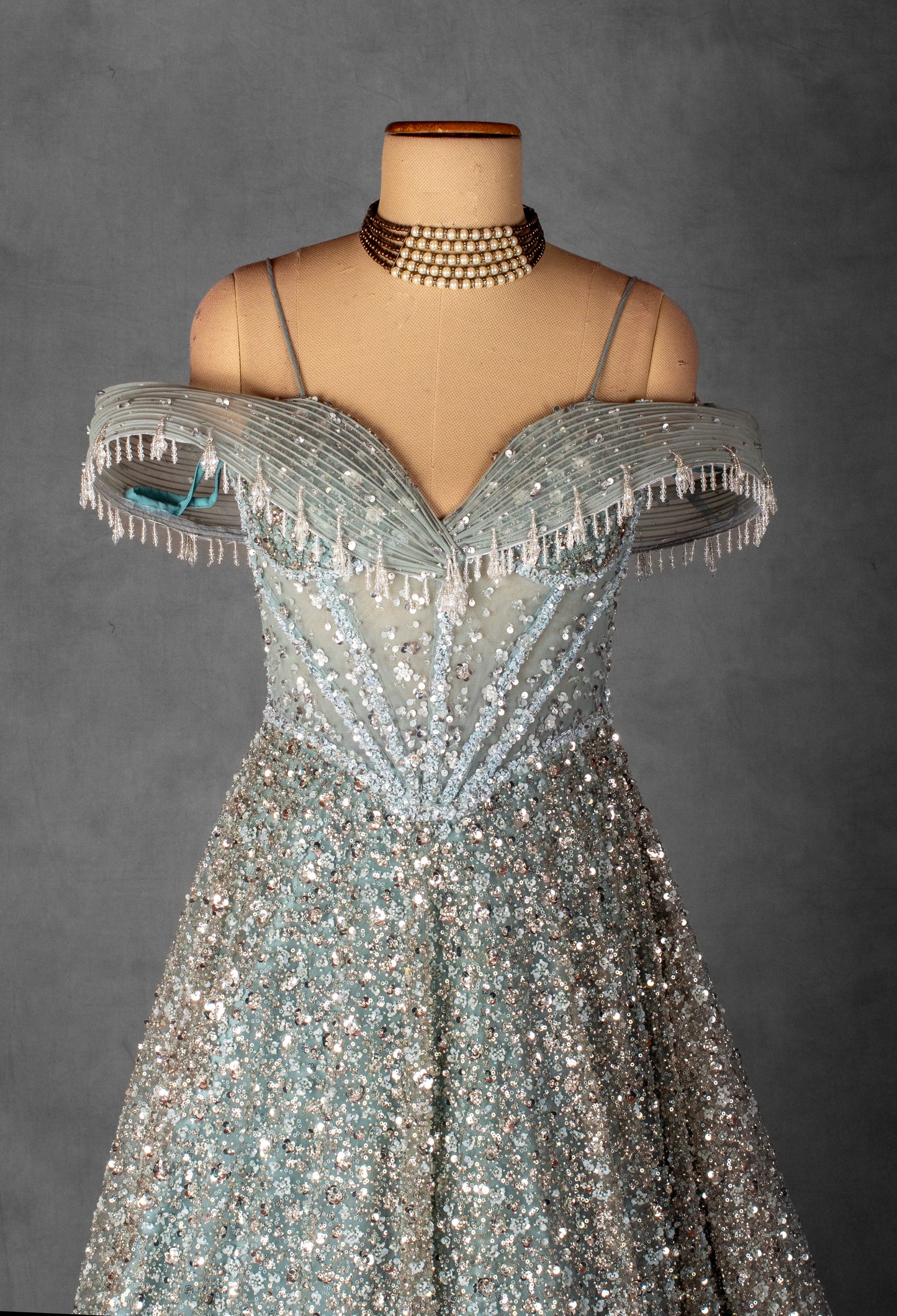 ice Blue Off-Shoulder Crystal Embellished Ball Gown with Beaded Draped Bodice