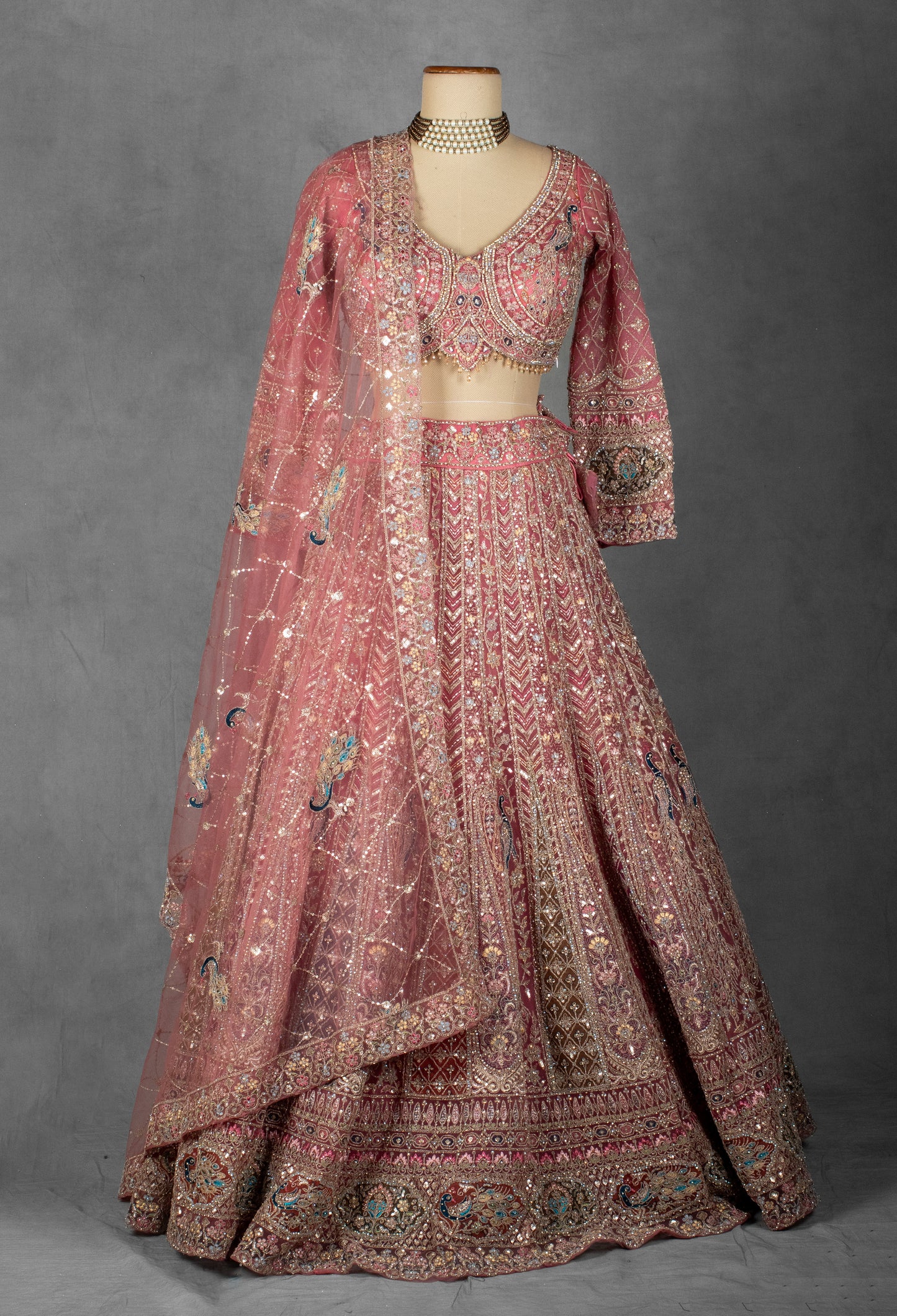 Dusty Rose Hand-Embroidered Bridal Lehenga with Peacock Motifs and Sequin Detailing