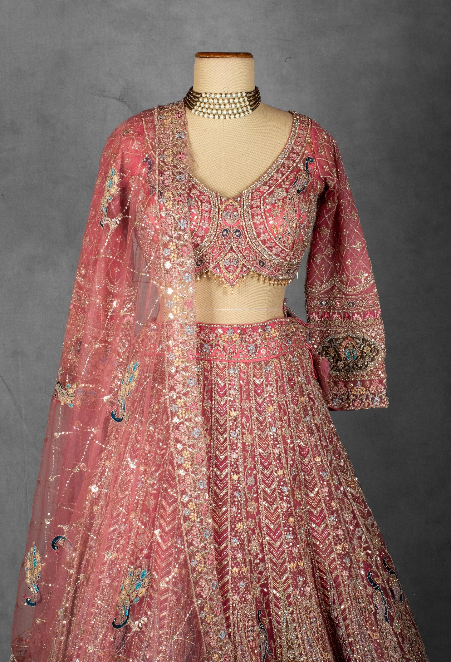 Dusty Rose Hand-Embroidered Bridal Lehenga with Peacock Motifs and Sequin Detailing