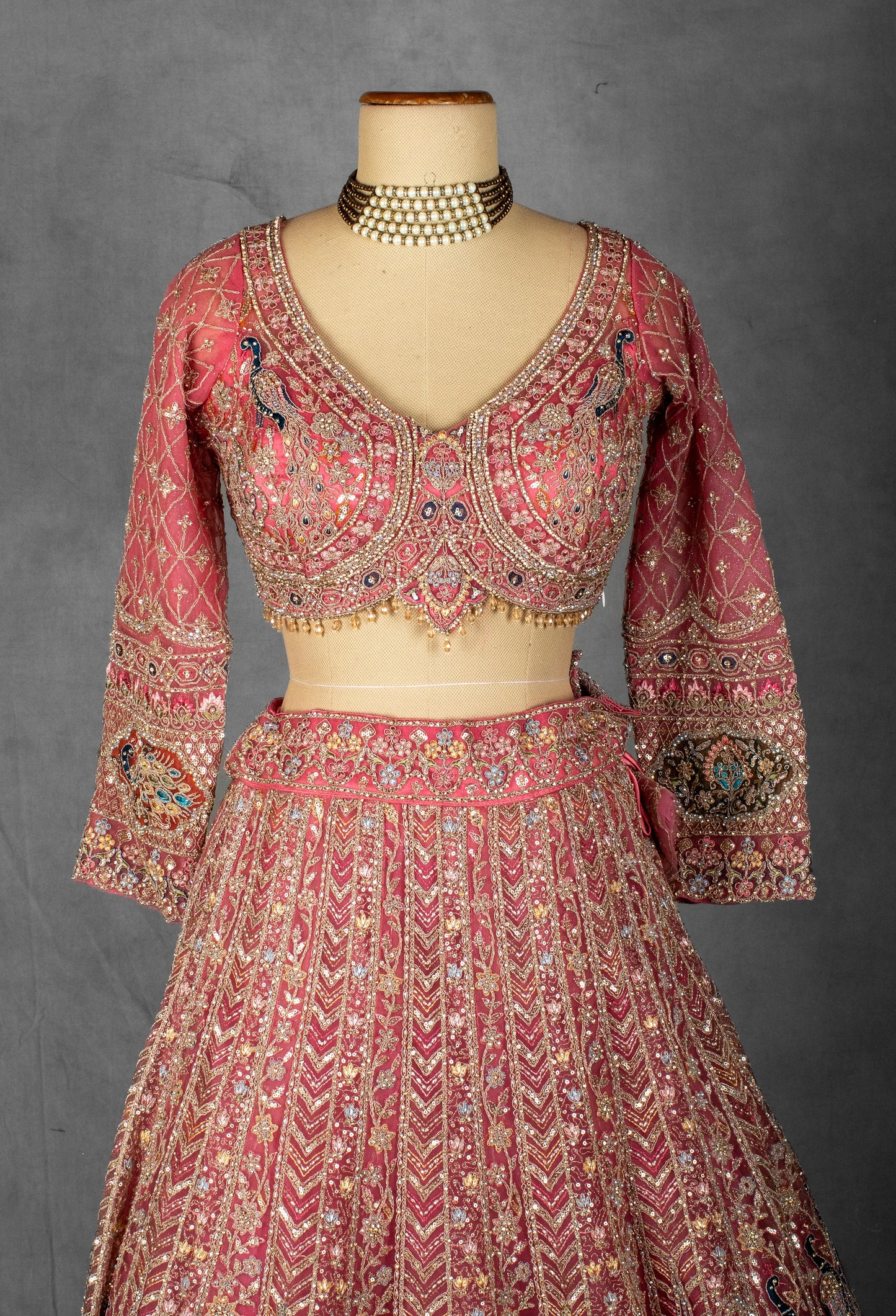 Dusty Rose Hand-Embroidered Bridal Lehenga with Peacock Motifs and Sequin Detailing