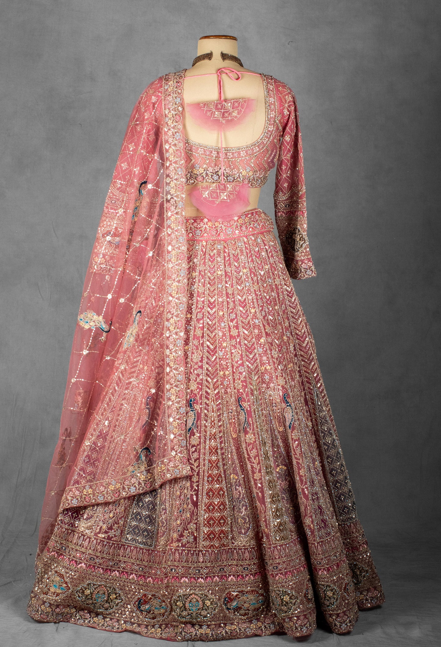 Dusty Rose Hand-Embroidered Bridal Lehenga with Peacock Motifs and Sequin Detailing