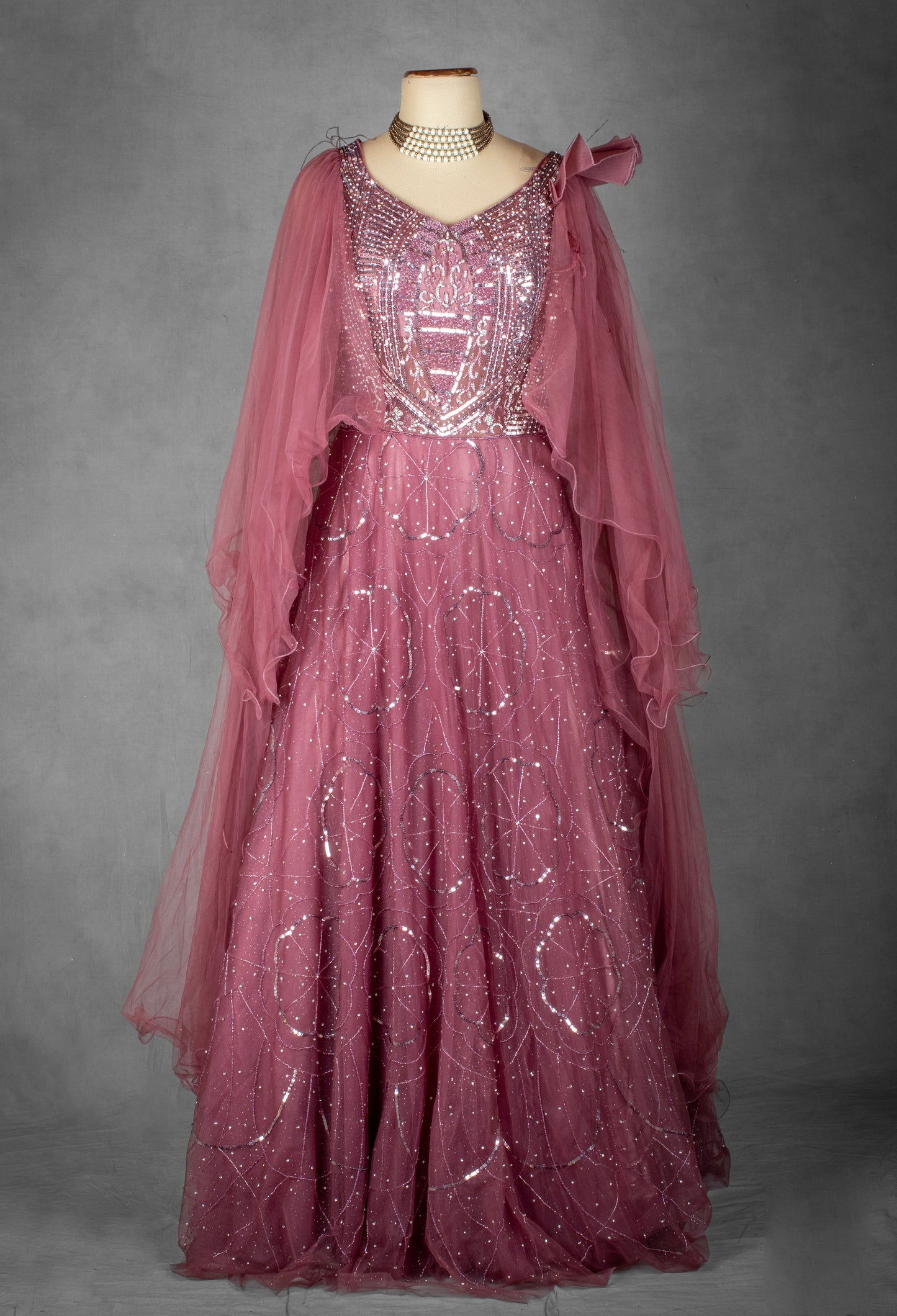 Mauve Sequined Gown with Ruffled Cape Sleeves and Hand-Embroidered Bodice