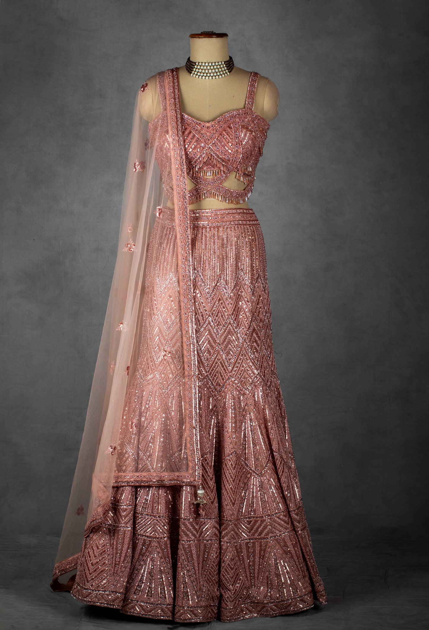 Blush Pink Sequin Embroidered Lehenga with Cutout Blouse and Net Dupatta