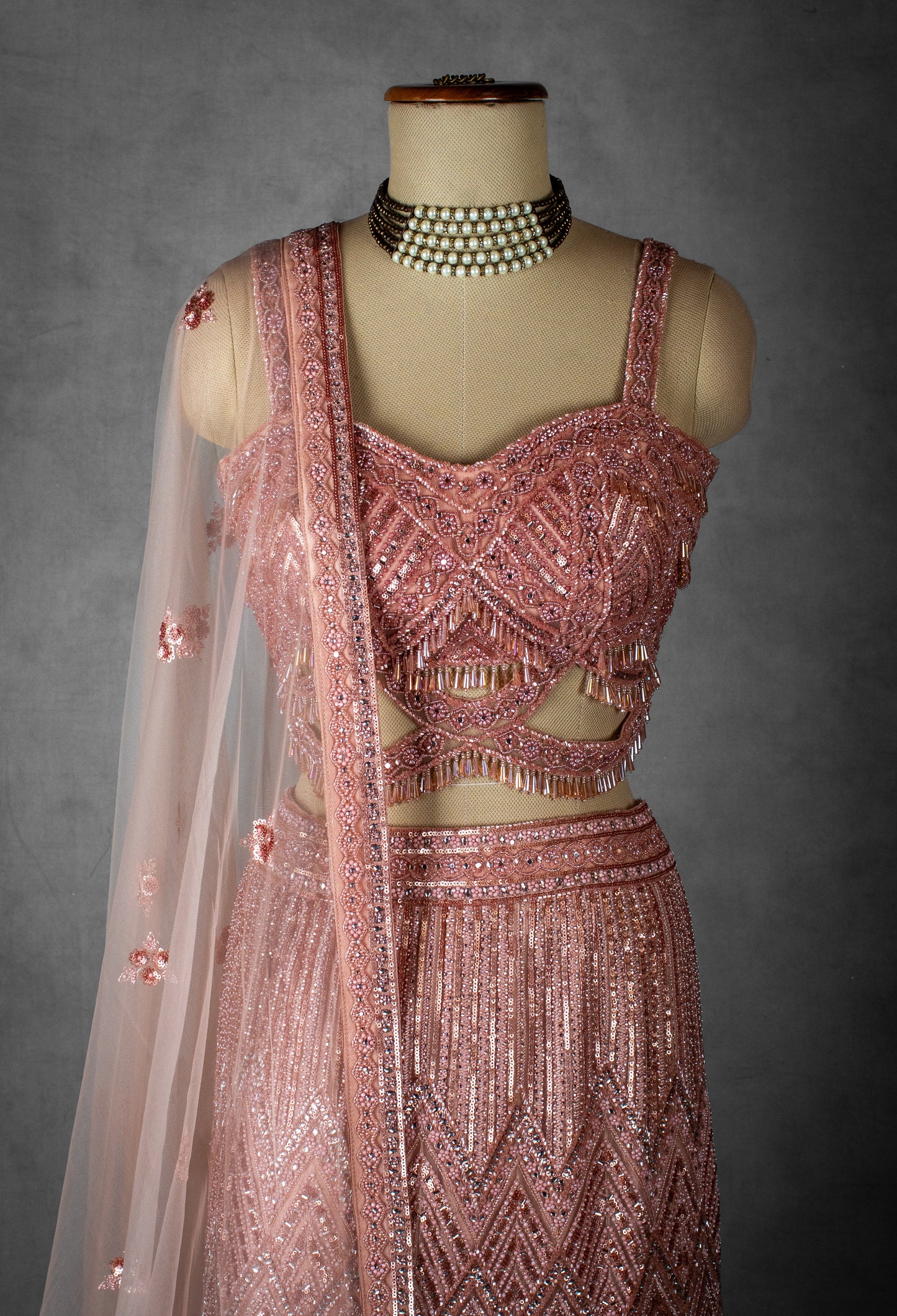 Blush Pink Sequin Embroidered Lehenga with Cutout Blouse and Net Dupatta