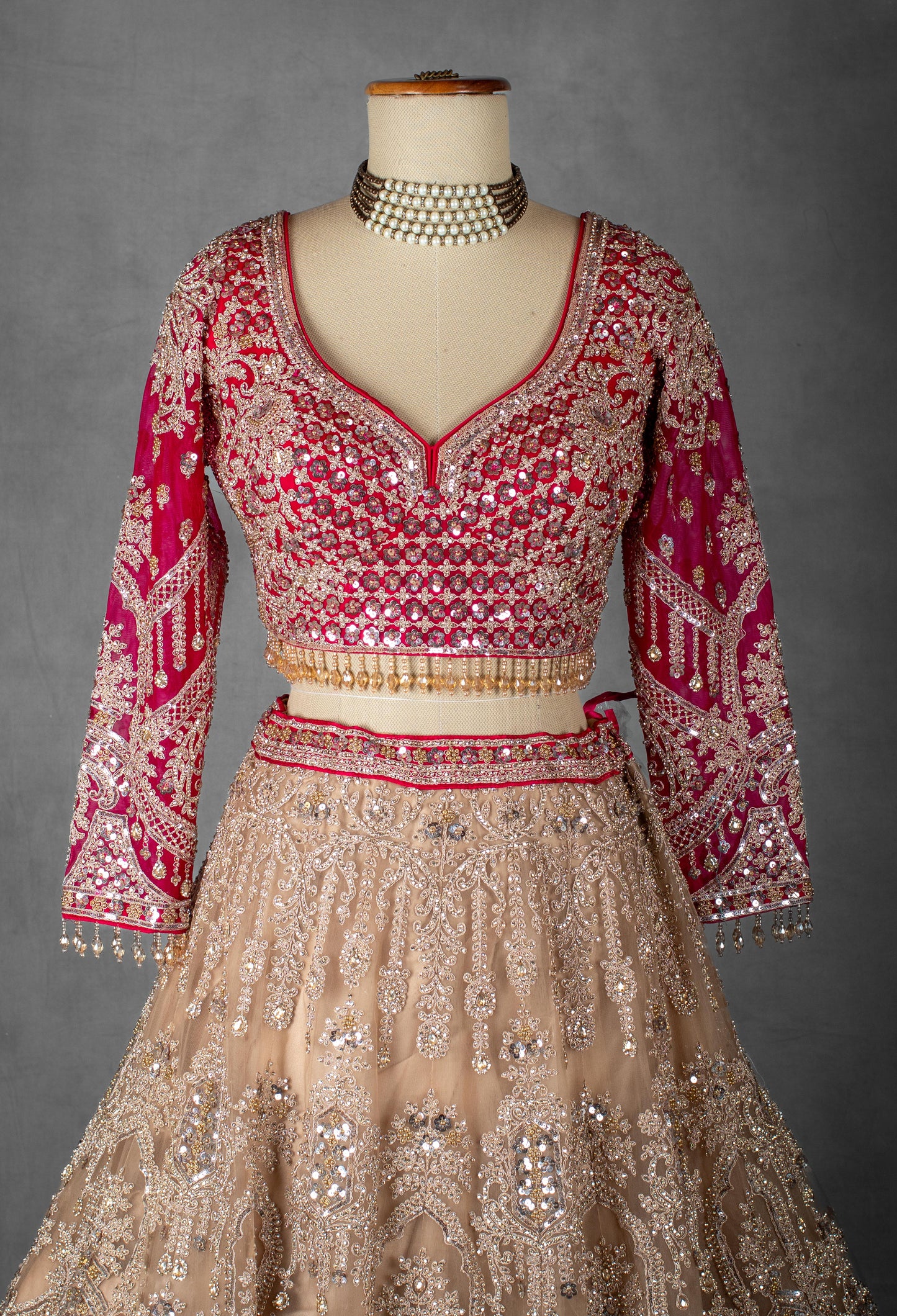 Rose Pink and Nude Gold Hand-Embroidered Lehenga with Full-Sleeve Blouse and Net Dupatta
