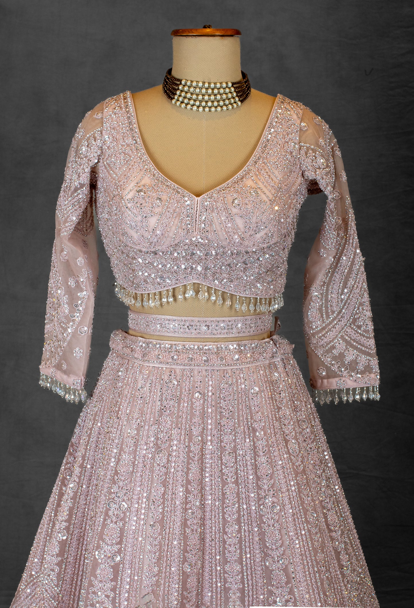 Blush Pink Sequin Embroidered Lehenga with Full-Sleeve Blouse and Net Dupatta