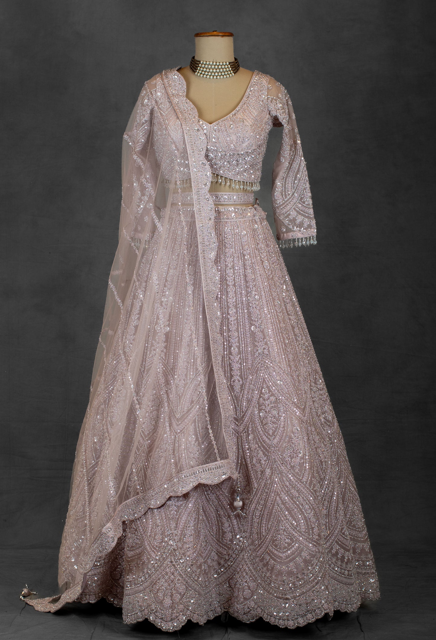 Blush Pink Sequin Embroidered Lehenga with Full-Sleeve Blouse and Net Dupatta