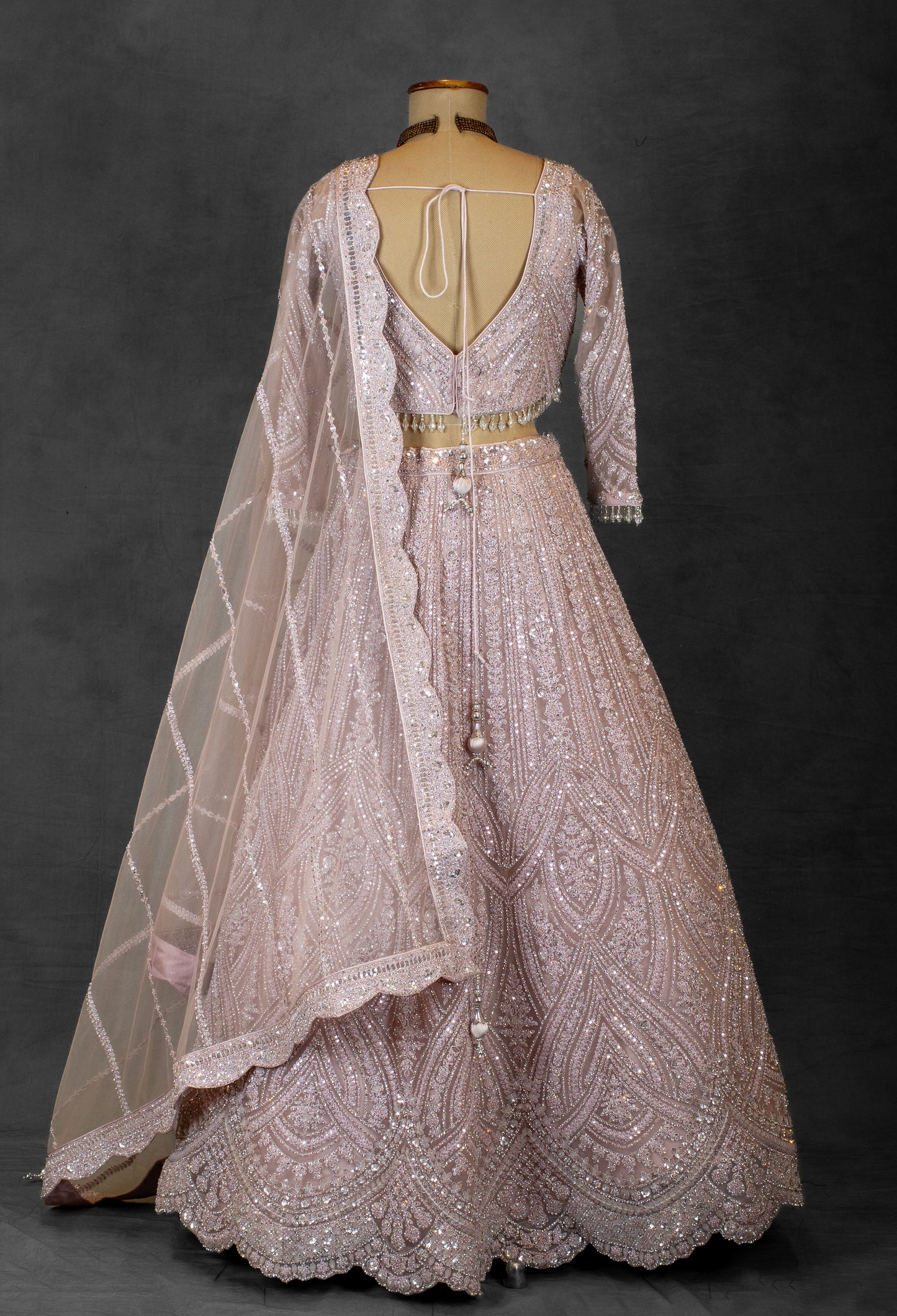 Blush Pink Sequin Embroidered Lehenga with Full-Sleeve Blouse and Net Dupatta
