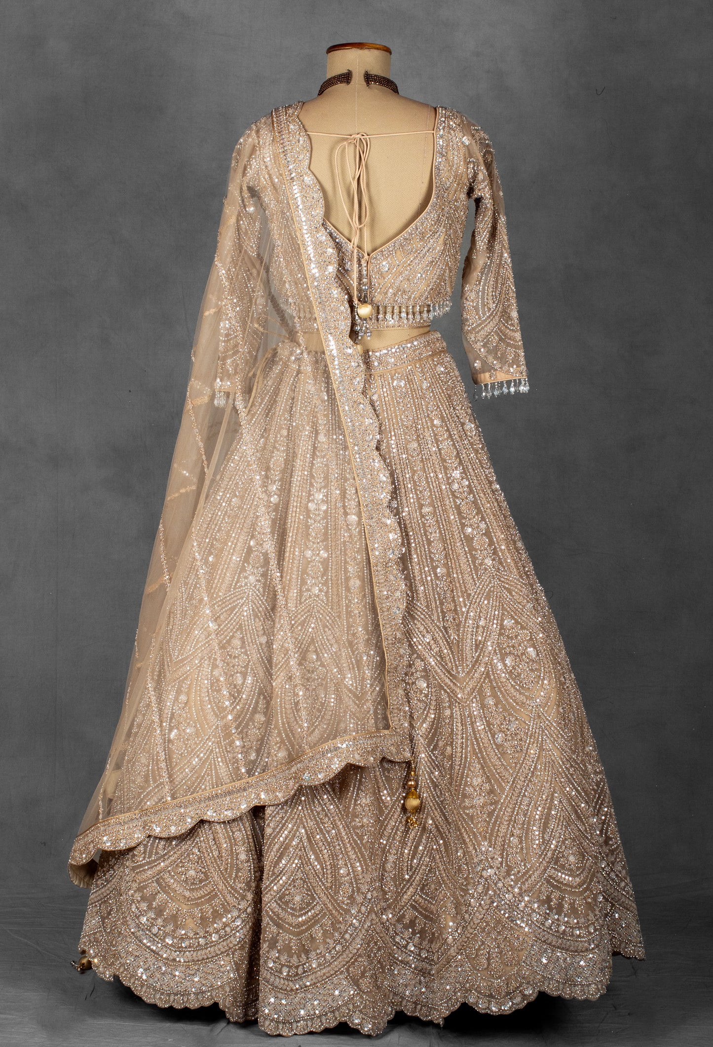 Champagne Gold Sequin Embroidered Lehenga with Full-Sleeve Blouse and Net Dupatta