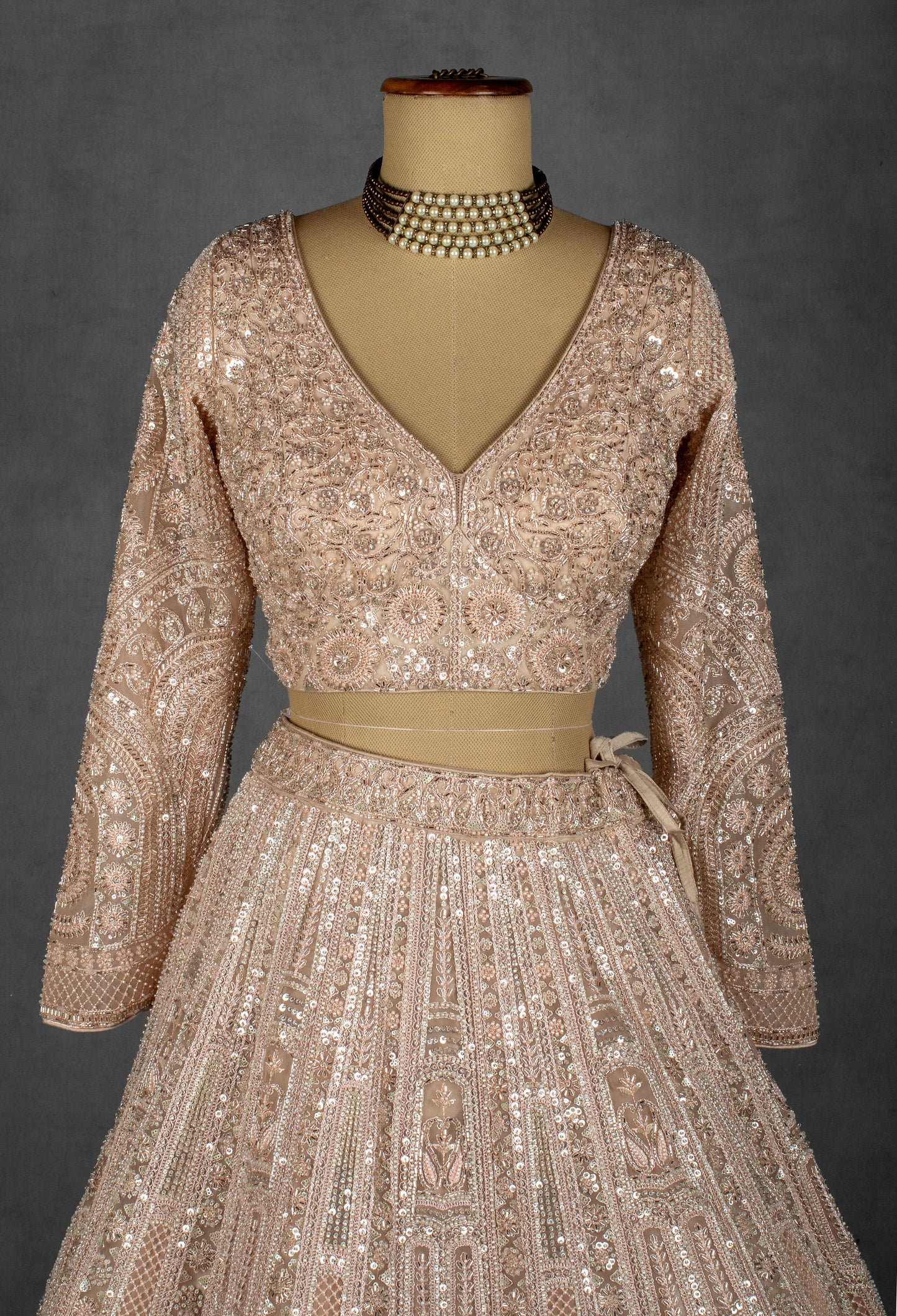 Champagne Nude Heavily Embroidered Sequin Lehenga with Full-Sleeve Blouse and Net Dupatta
