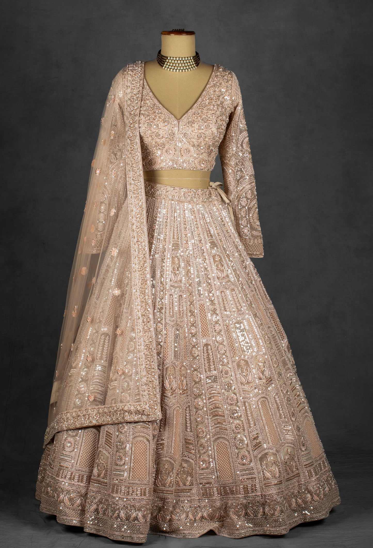 Champagne Nude Heavily Embroidered Sequin Lehenga with Full-Sleeve Blouse and Net Dupatta
