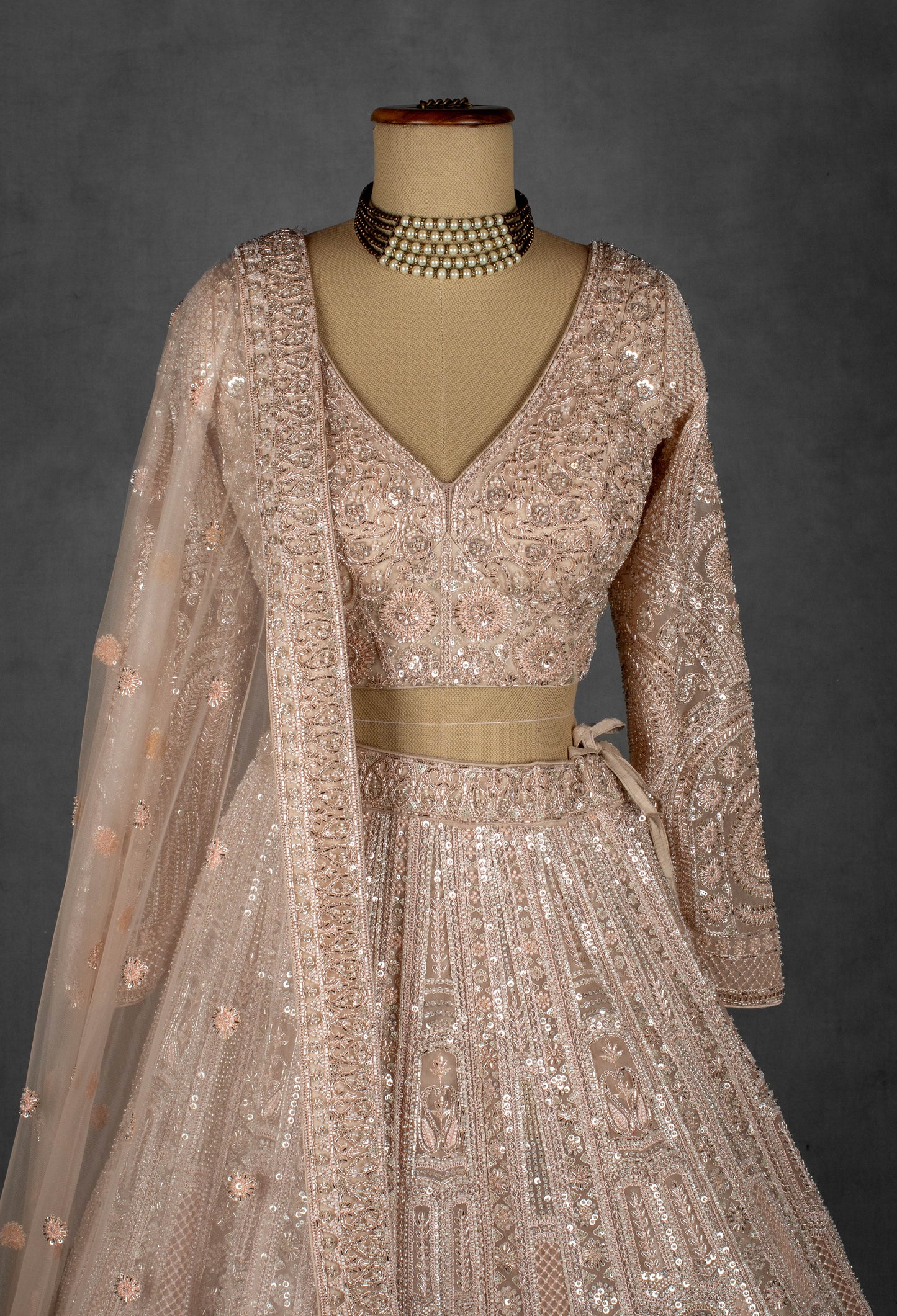 Champagne Nude Heavily Embroidered Sequin Lehenga with Full-Sleeve Blouse and Net Dupatta