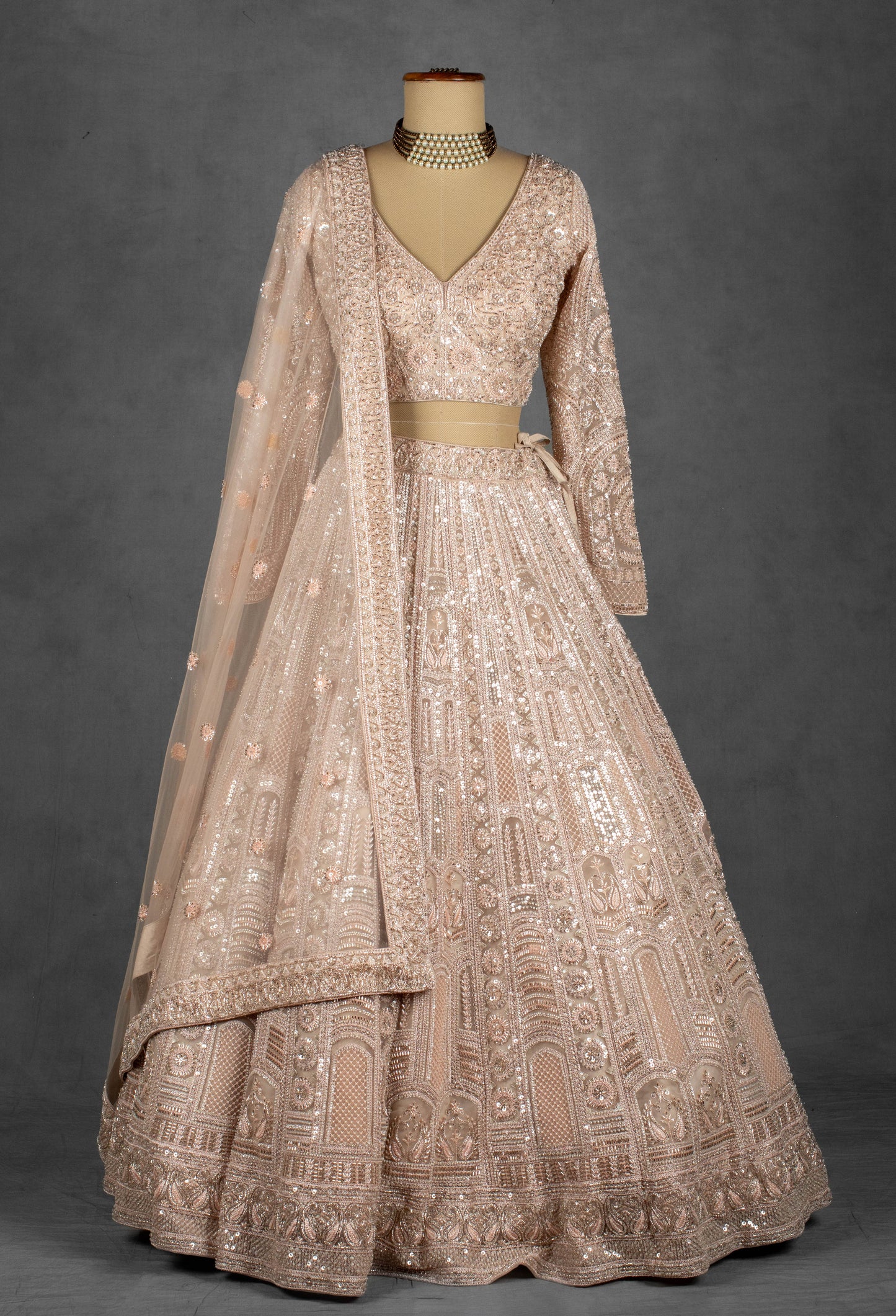 Champagne Nude Heavily Embroidered Sequin Lehenga with Full-Sleeve Blouse and Net Dupatta