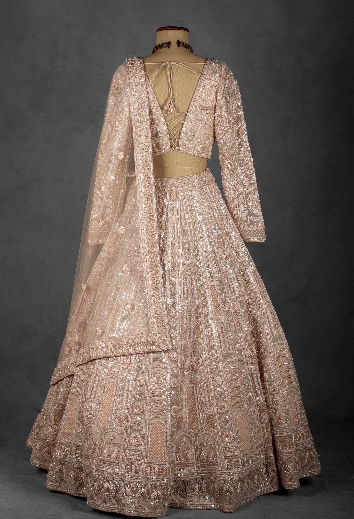 Champagne Nude Heavily Embroidered Sequin Lehenga with Full-Sleeve Blouse and Net Dupatta