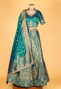 Teal Banarasi Brocade Lehenga with Embellished Crop Top & Woven Silk Dupatta