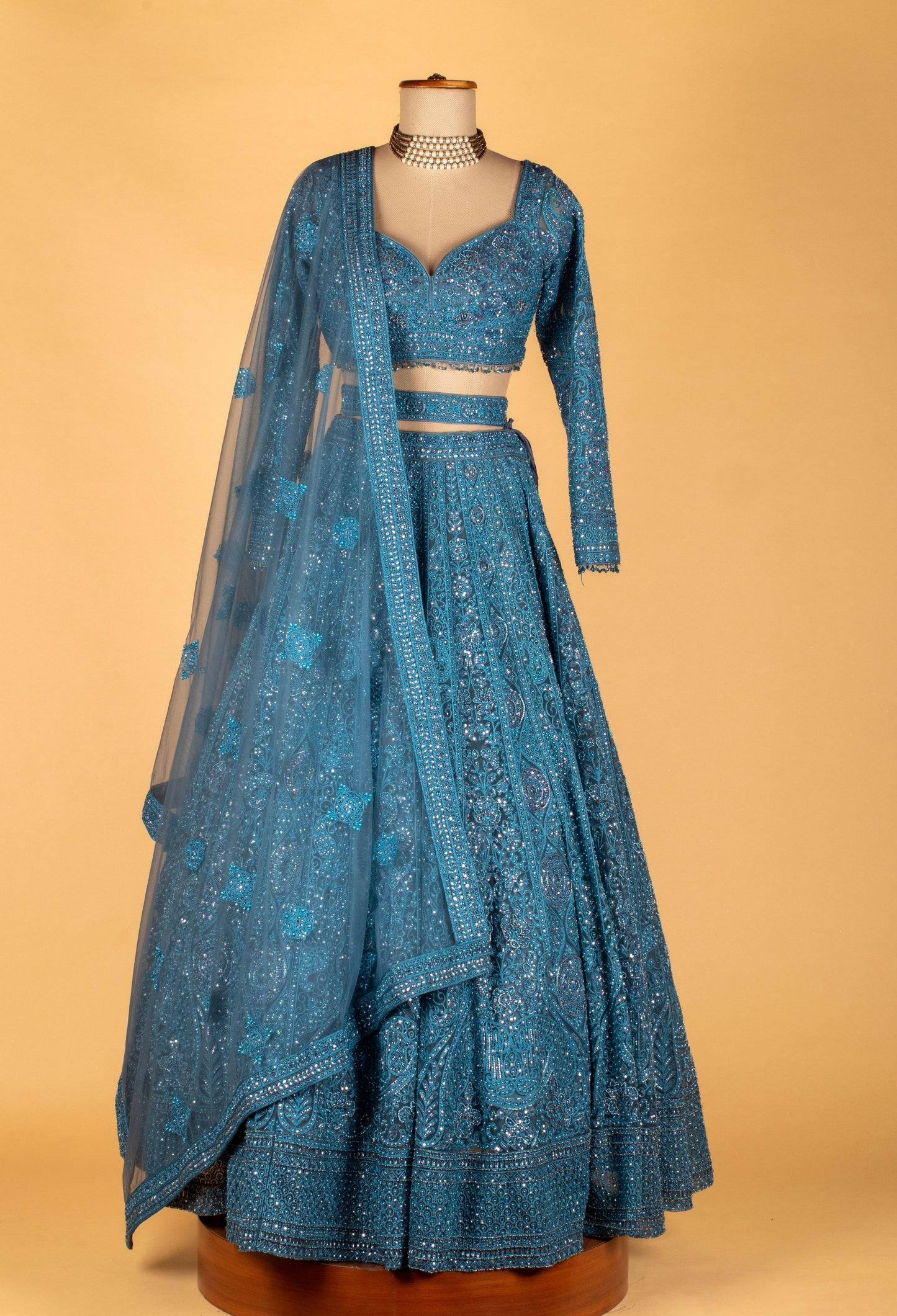 Teal Intricately Hand-Embroidered Lehenga with Long-Sleeve Crop Top & Textured Net Dupatta