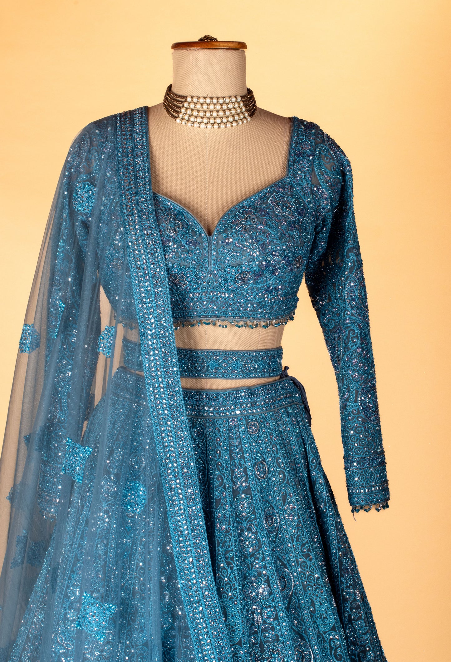Teal Intricately Hand-Embroidered Lehenga with Long-Sleeve Crop Top & Textured Net Dupatta
