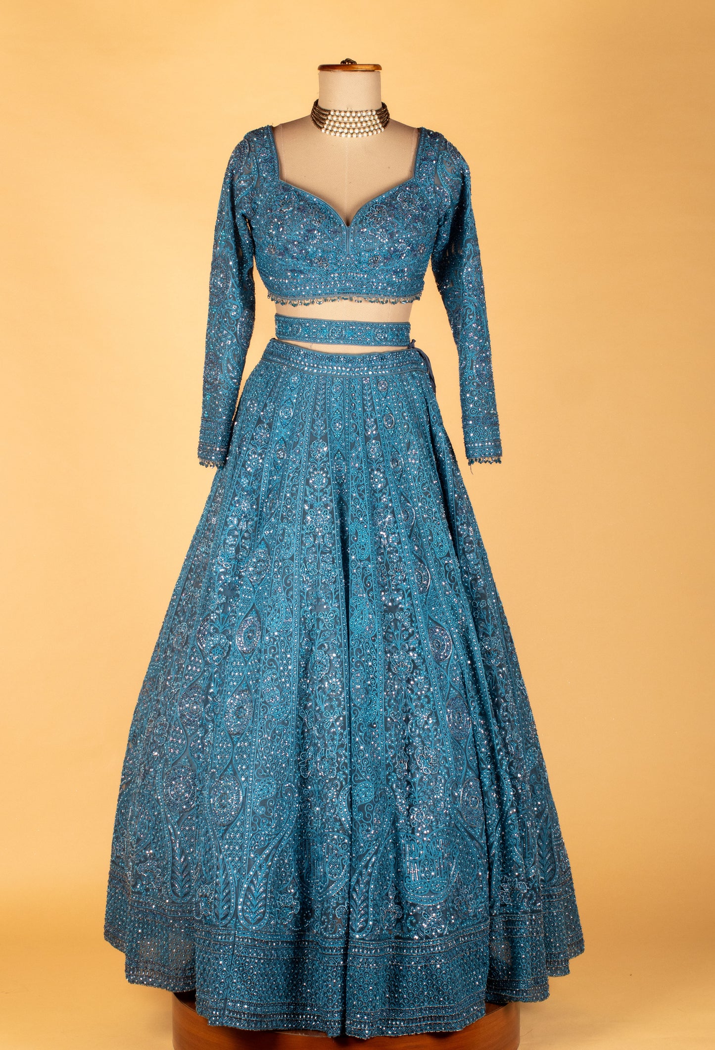 Teal Intricately Hand-Embroidered Lehenga with Long-Sleeve Crop Top & Textured Net Dupatta