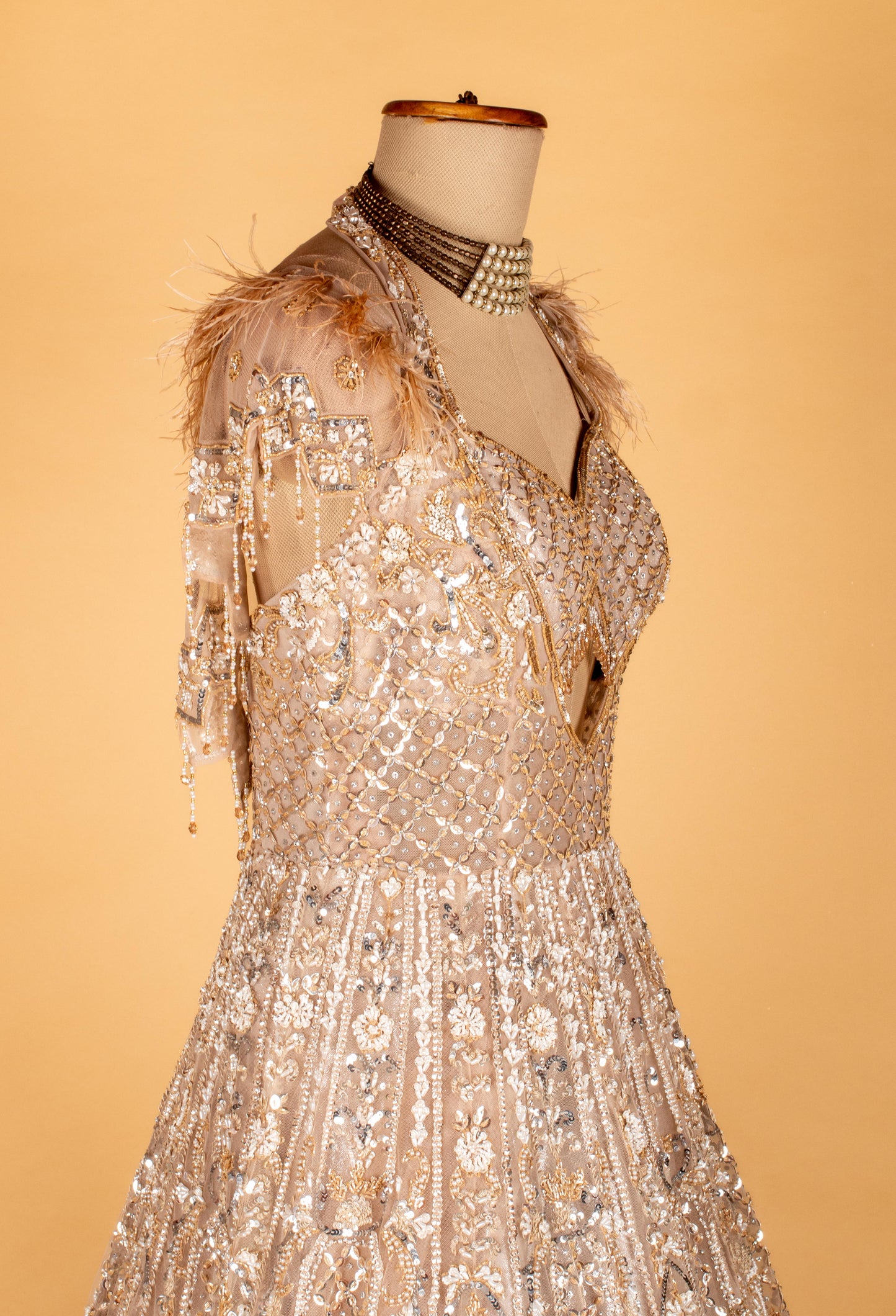 Champagne Gold Fully Hand-Embroidered Bridal Gown with Feathered Shoulders & Cut-Out Bodice