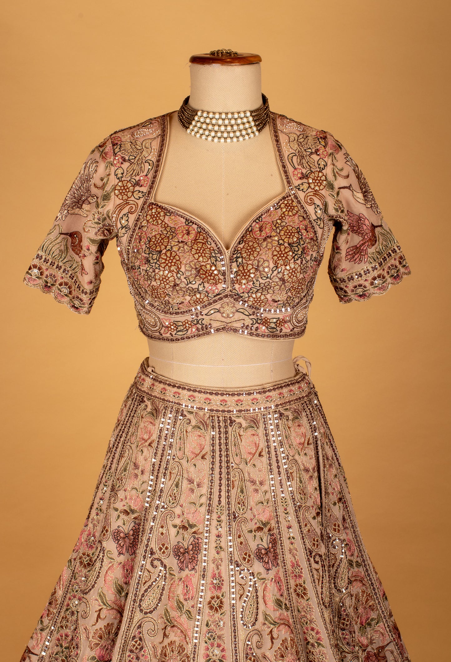 Blush Pink Hand-Embroidered Lehenga with Multicolor Floral & Bird Motifs