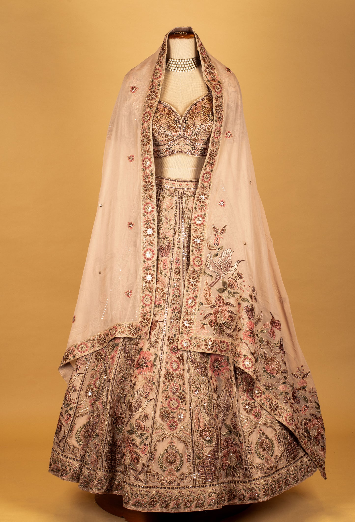 Blush Pink Hand-Embroidered Lehenga with Multicolor Floral & Bird Motifs