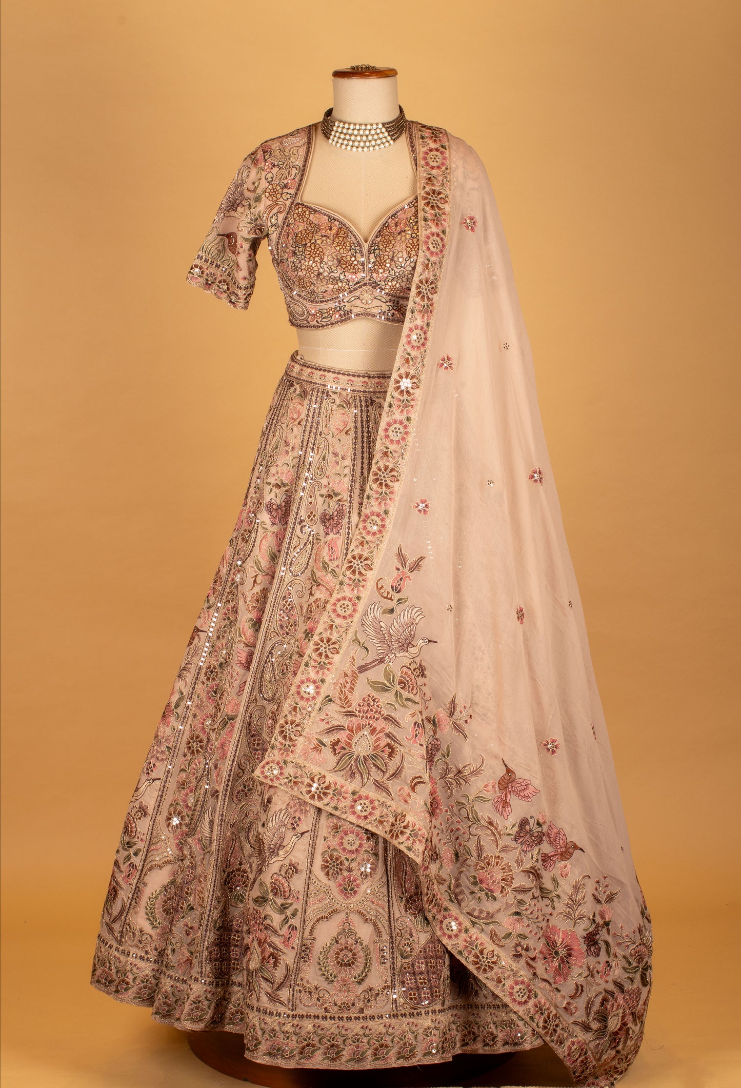 Blush Pink Hand-Embroidered Lehenga with Multicolor Floral & Bird Motifs