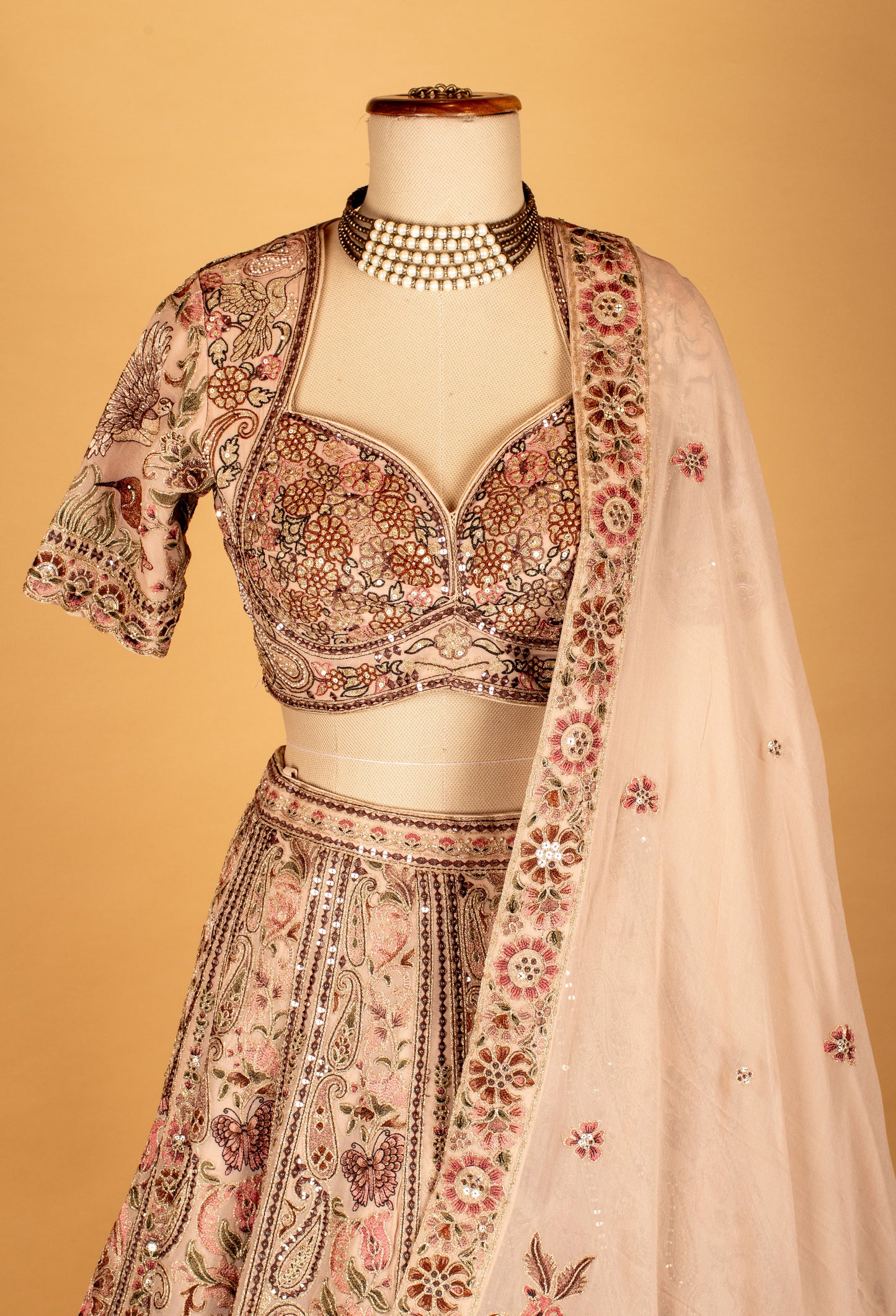 Blush Pink Hand-Embroidered Lehenga with Multicolor Floral & Bird Motifs