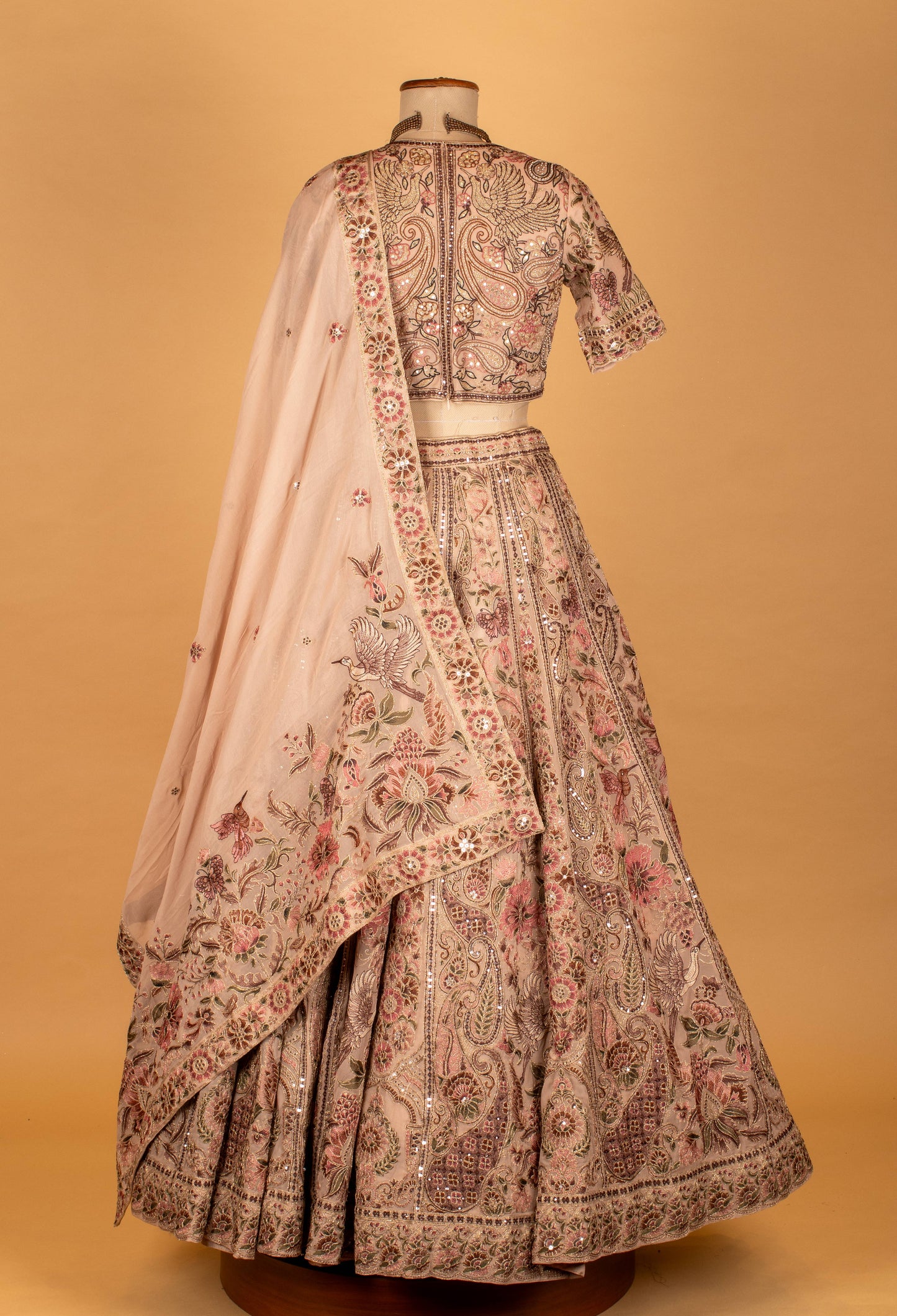 Blush Pink Hand-Embroidered Lehenga with Multicolor Floral & Bird Motifs