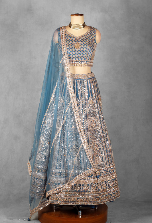 Powder blue heavy embroidered bridal lehenga with mirror work blouse and net dupatta – product image 2